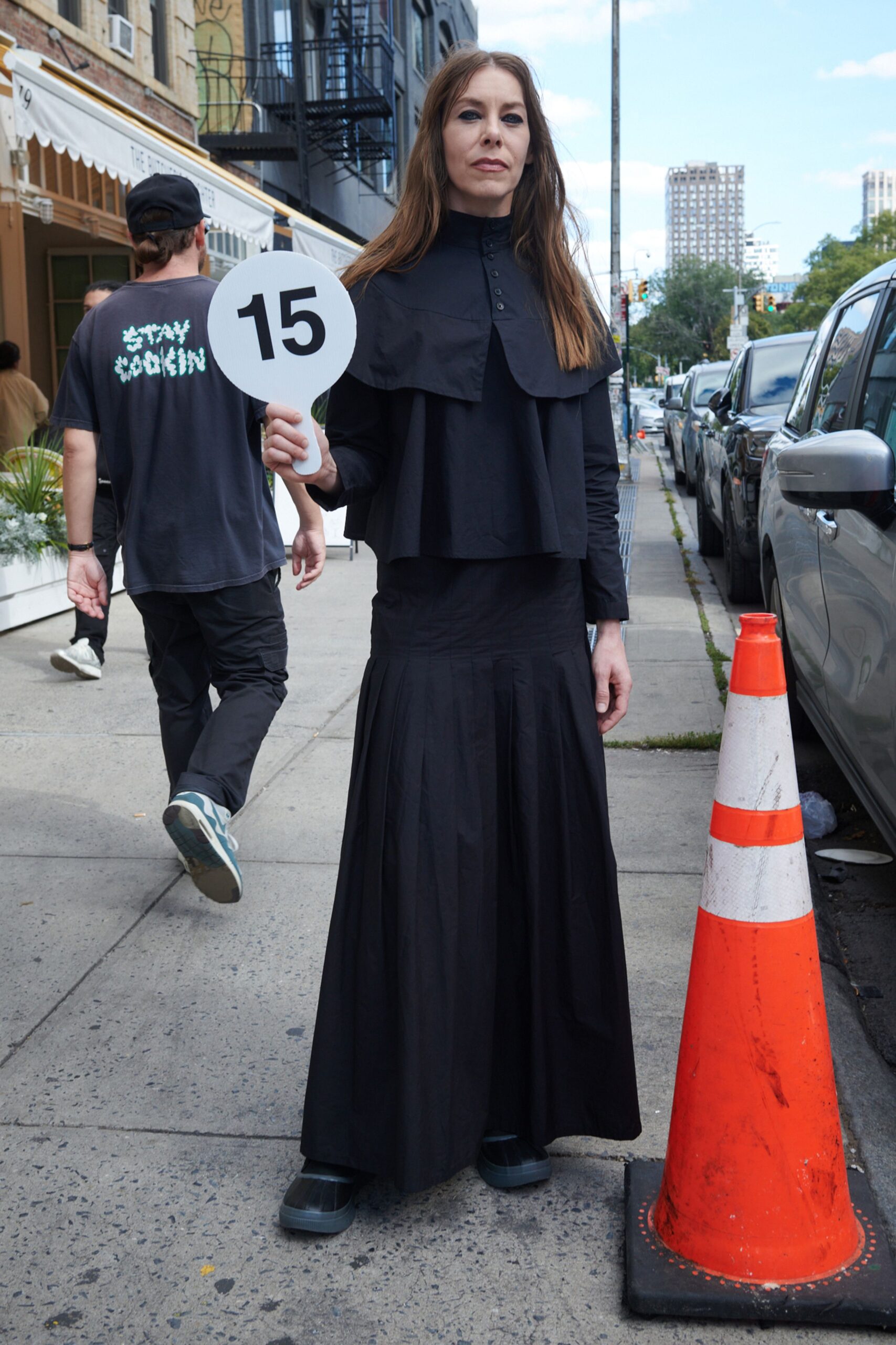 black layered top and pleated maxi skirt