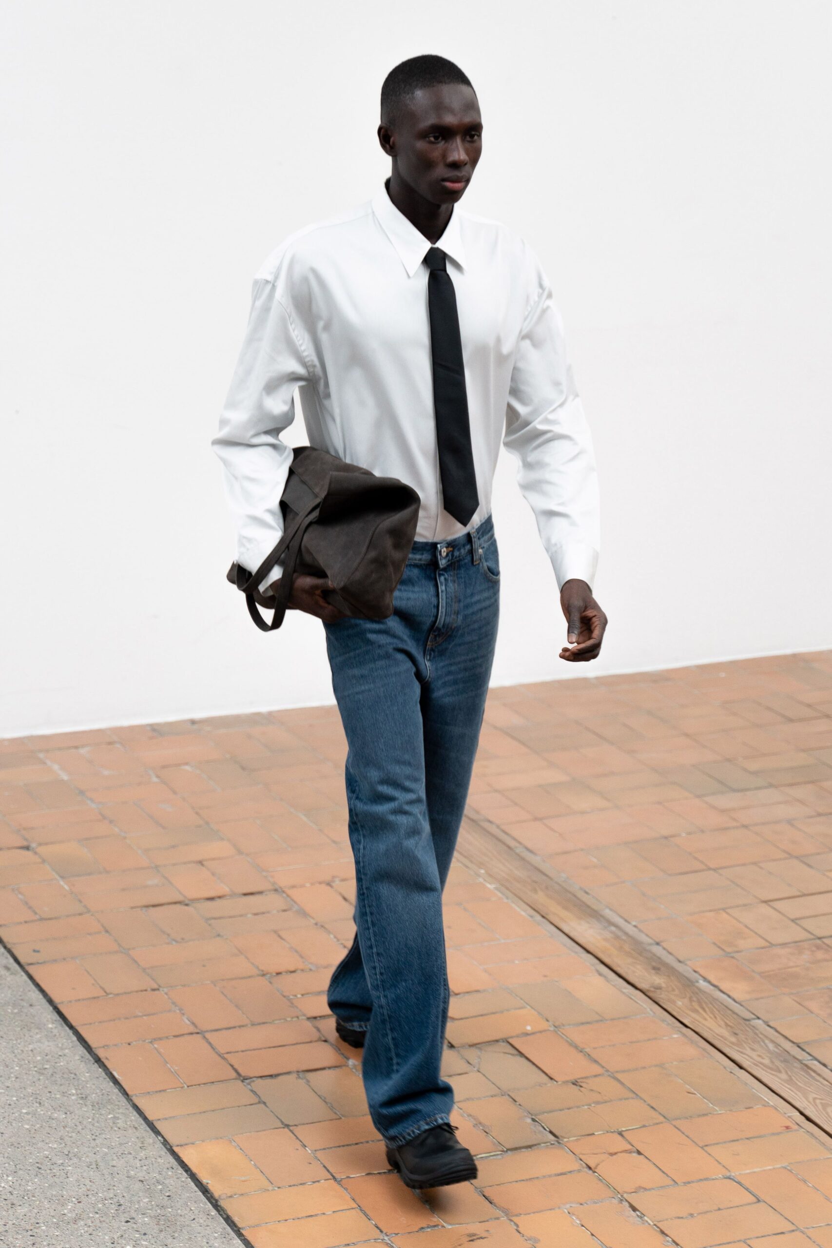 white shirt black tie blue jeans