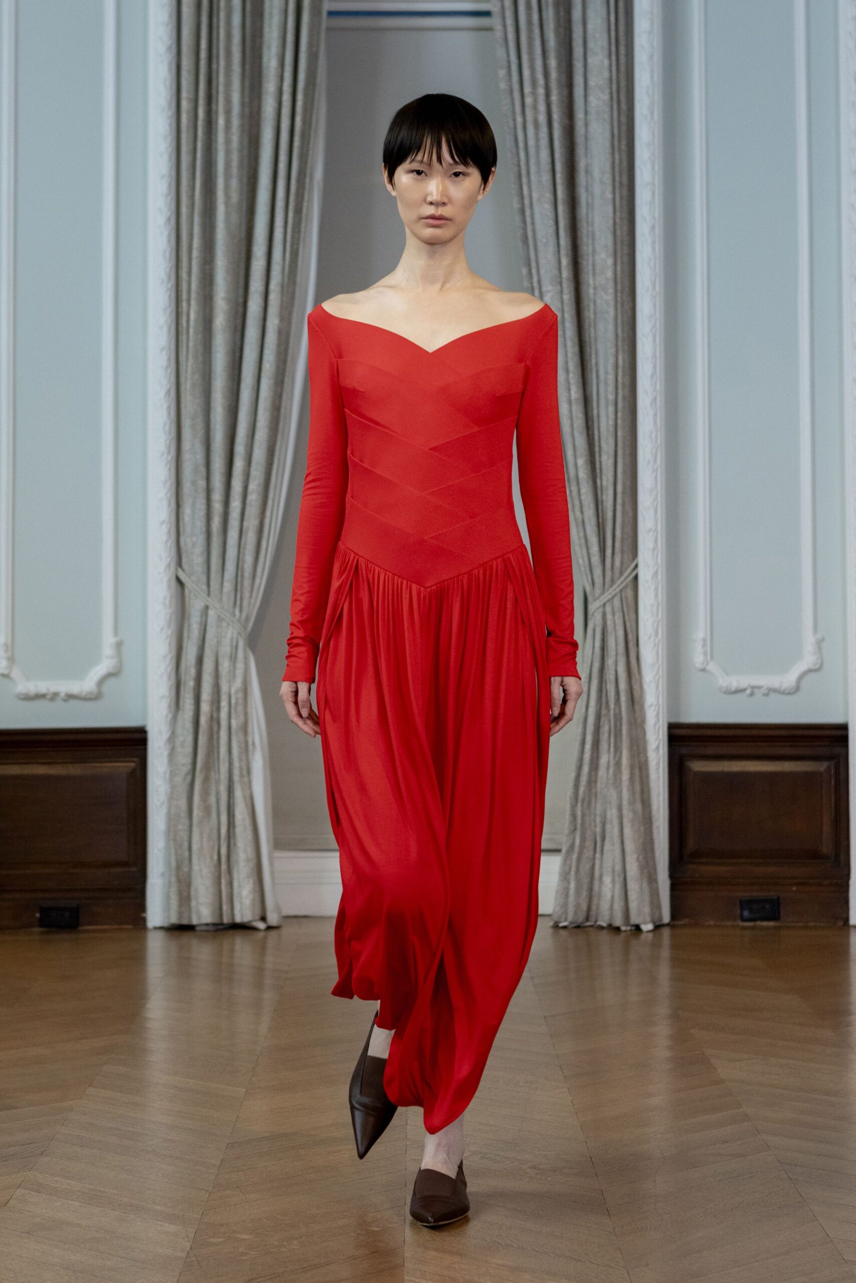 red silk long-sleeve off-shoulder fitted ruched maxi gown