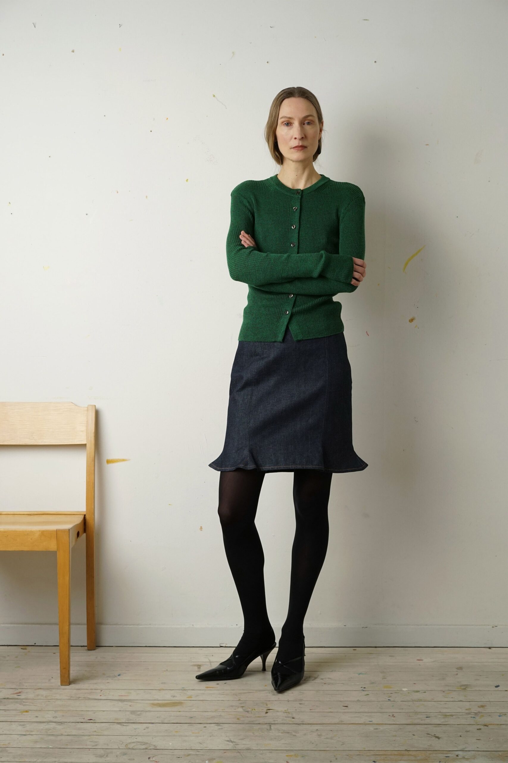 green wool cardigan with blue skirt