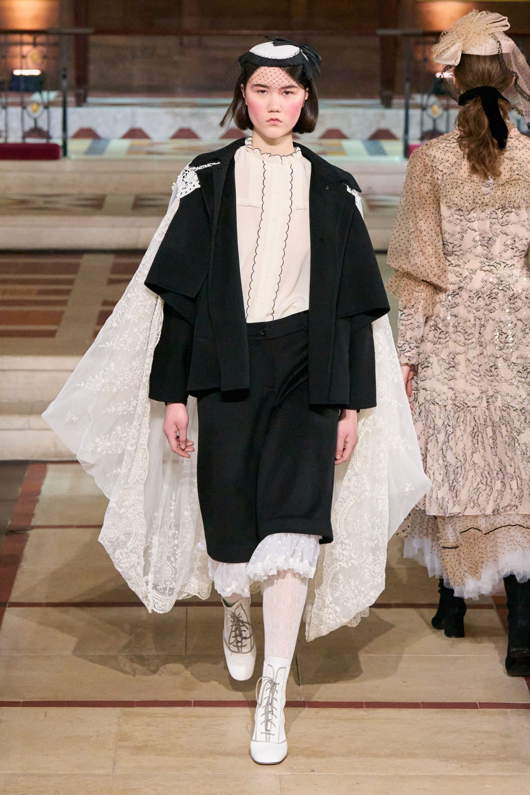 black jacket white blouse black skirt