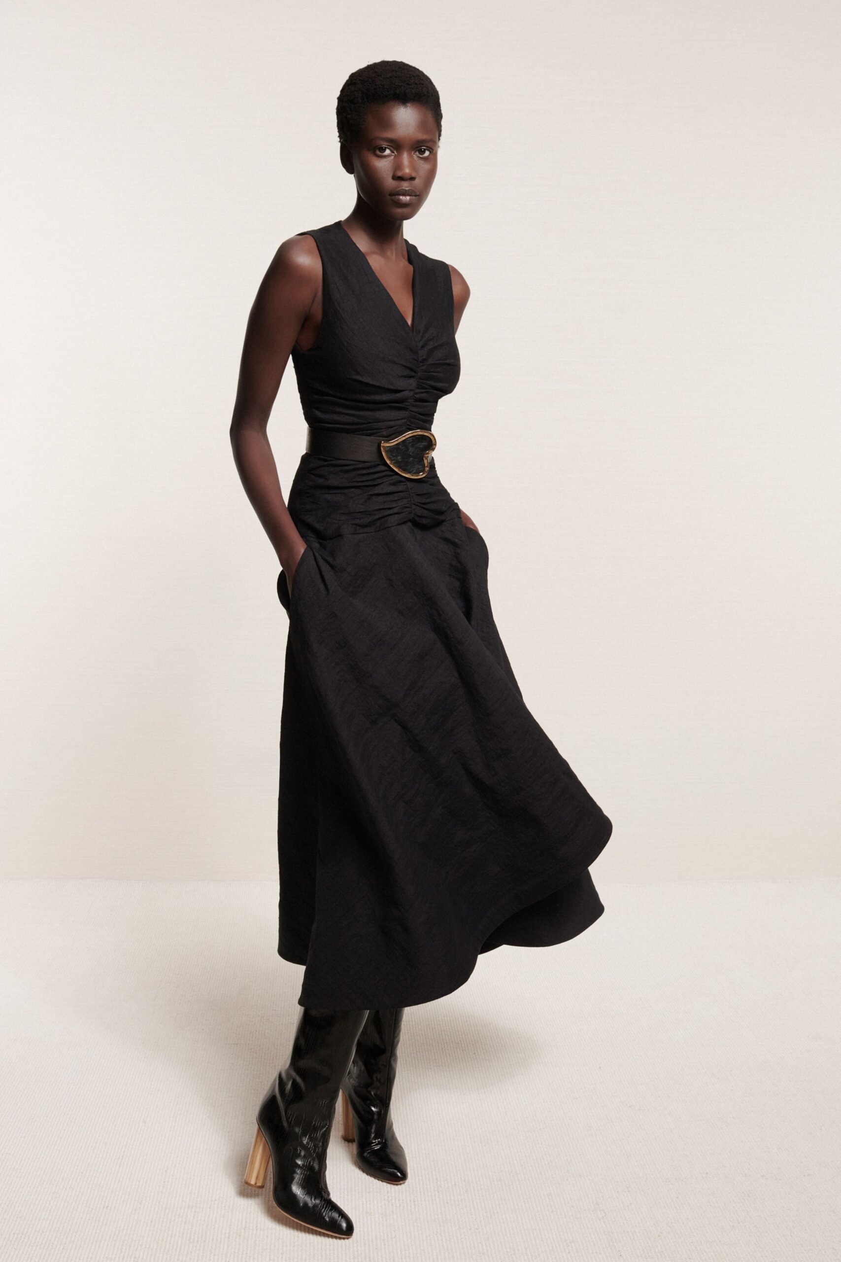 black fitted midi dress with boots