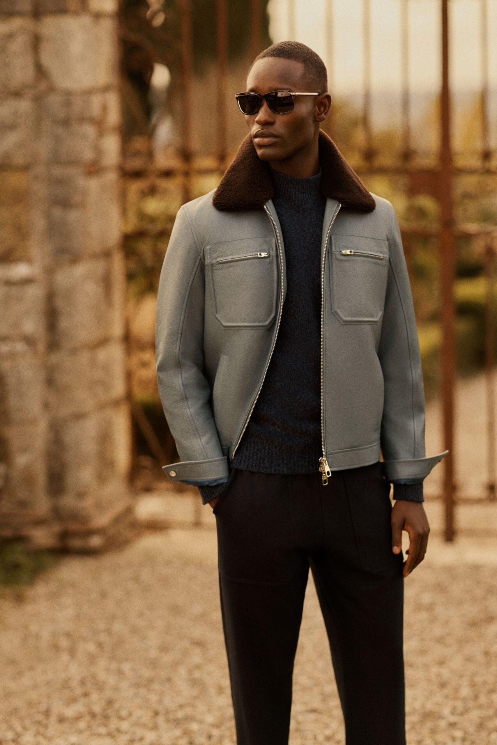 gray leather long-sleeve collared fitted zippered pockets jacket