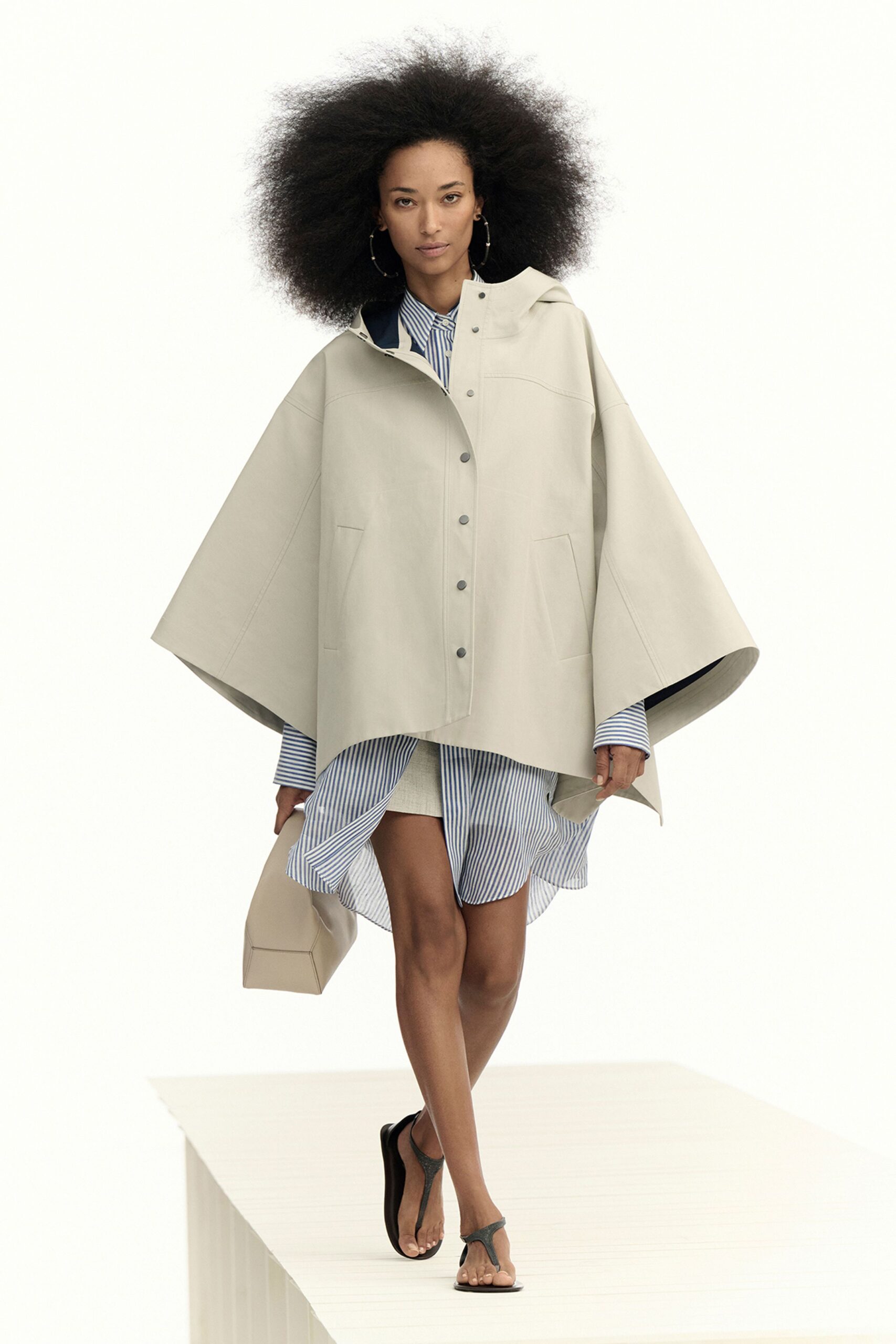 beige leather cape with striped shirt