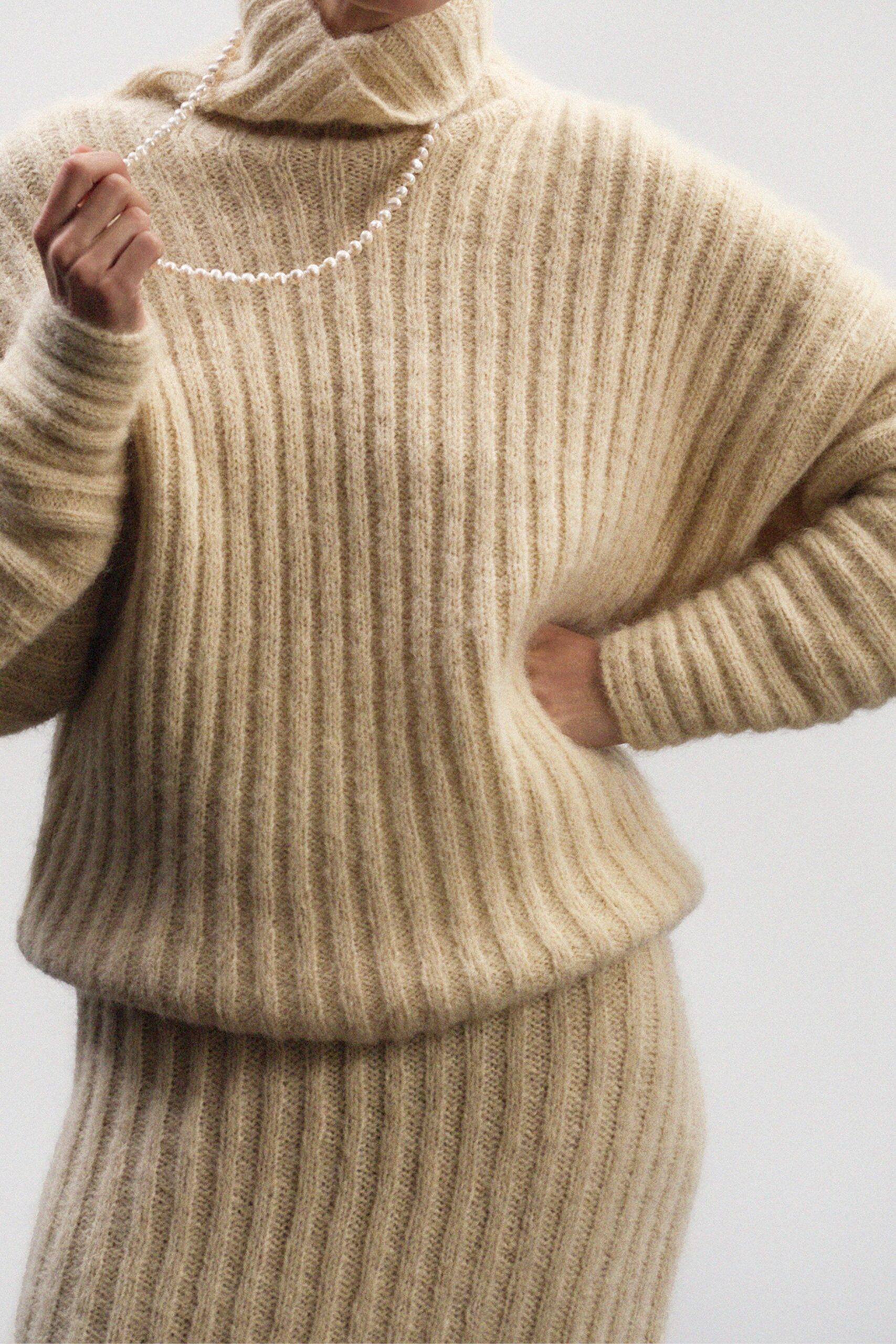 beige wool relaxed top and fitted skirt