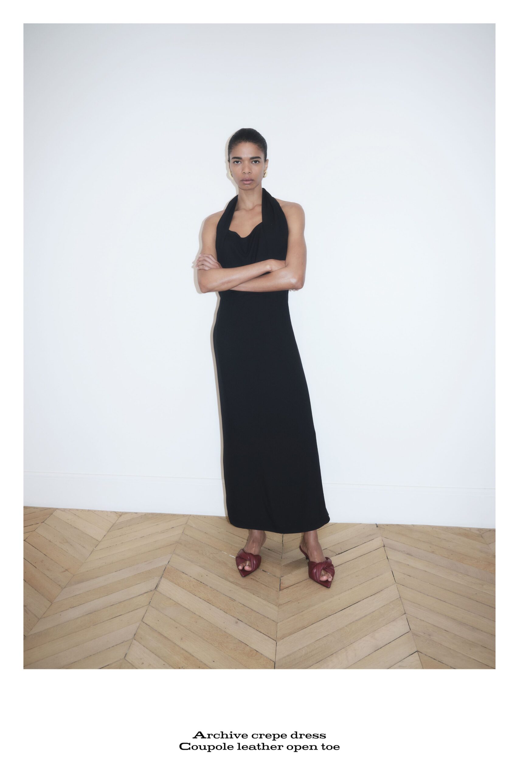 black fitted halter dress with open toe shoes