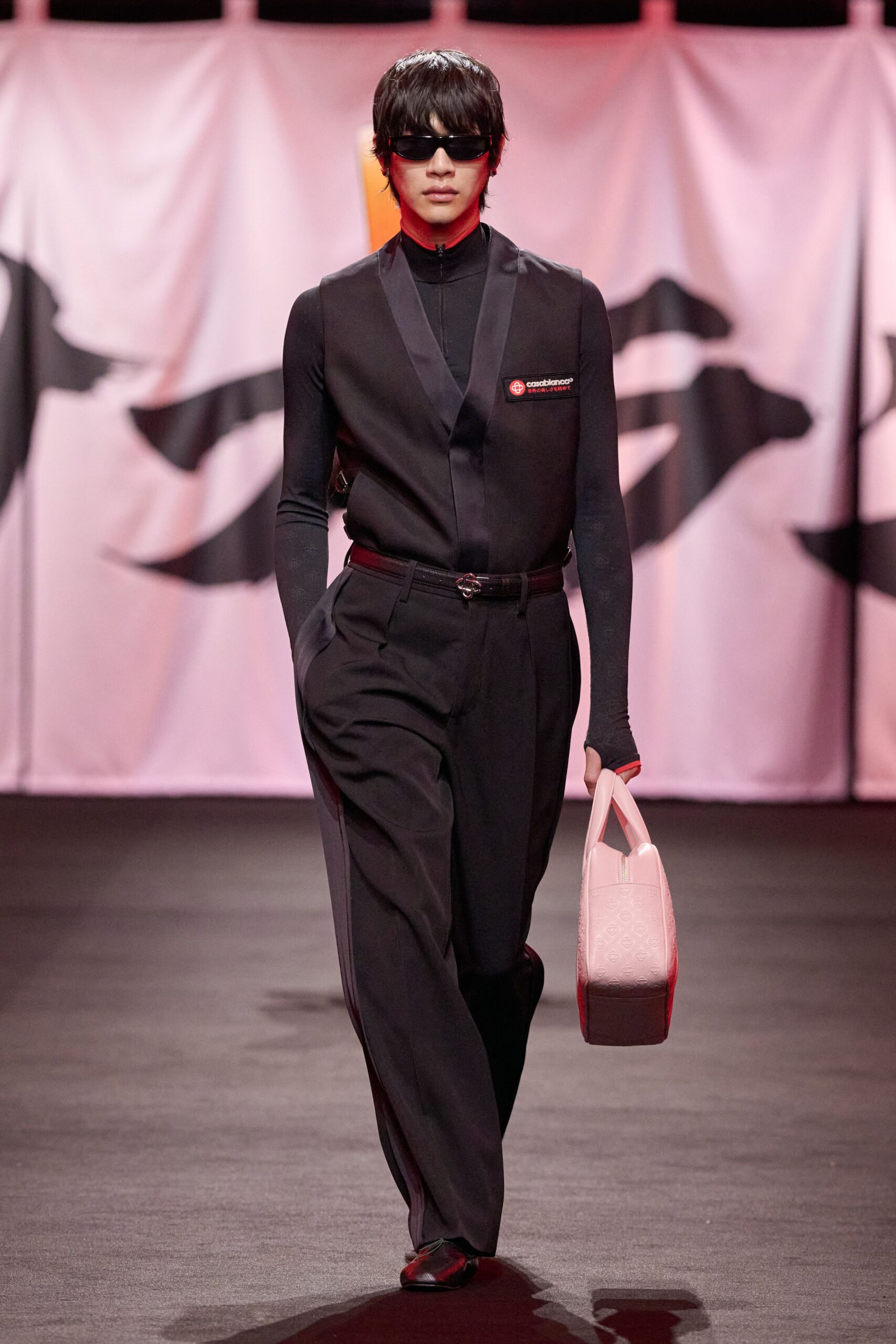 black fitted vest with relaxed pants
