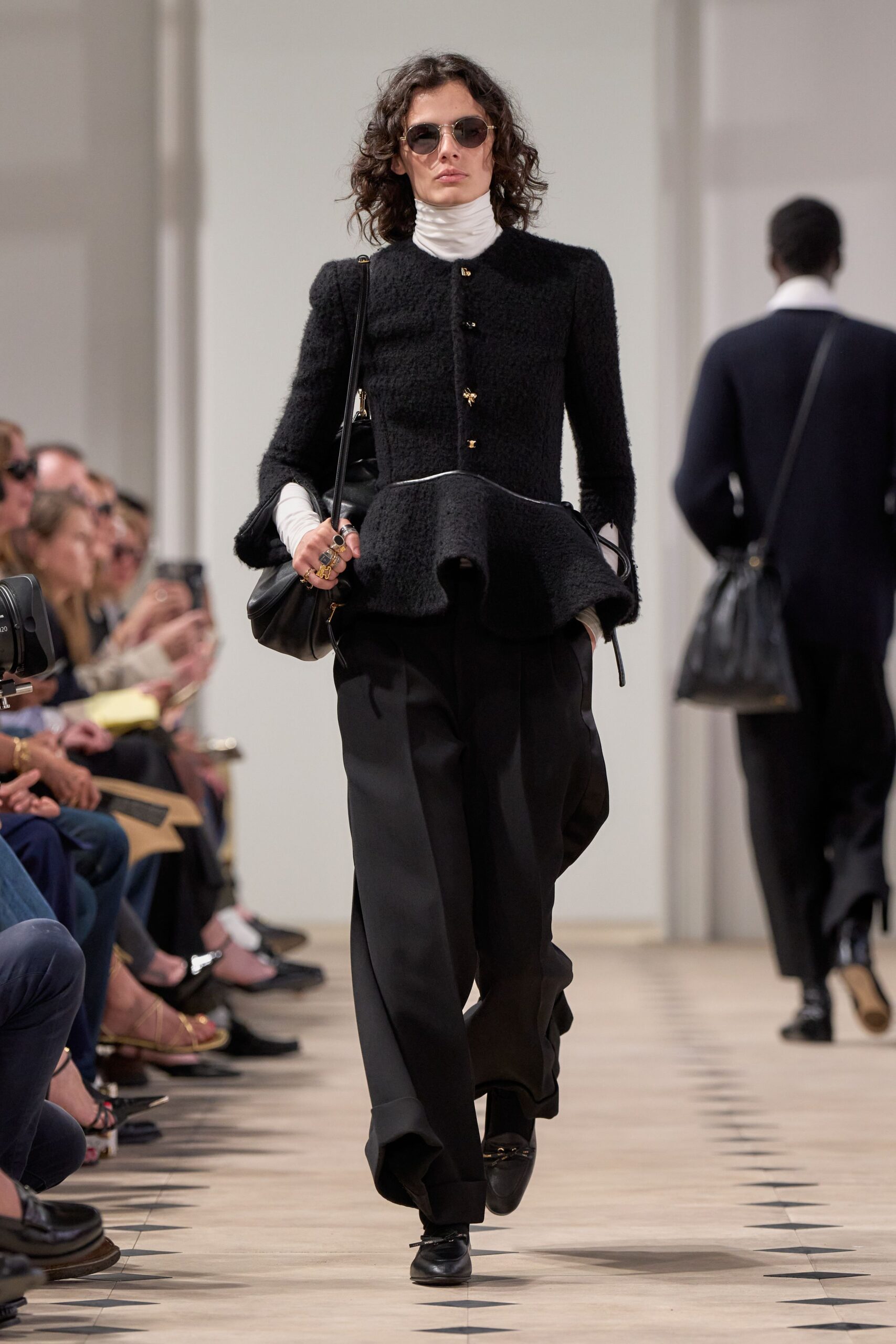 black textured jacket with wide pants