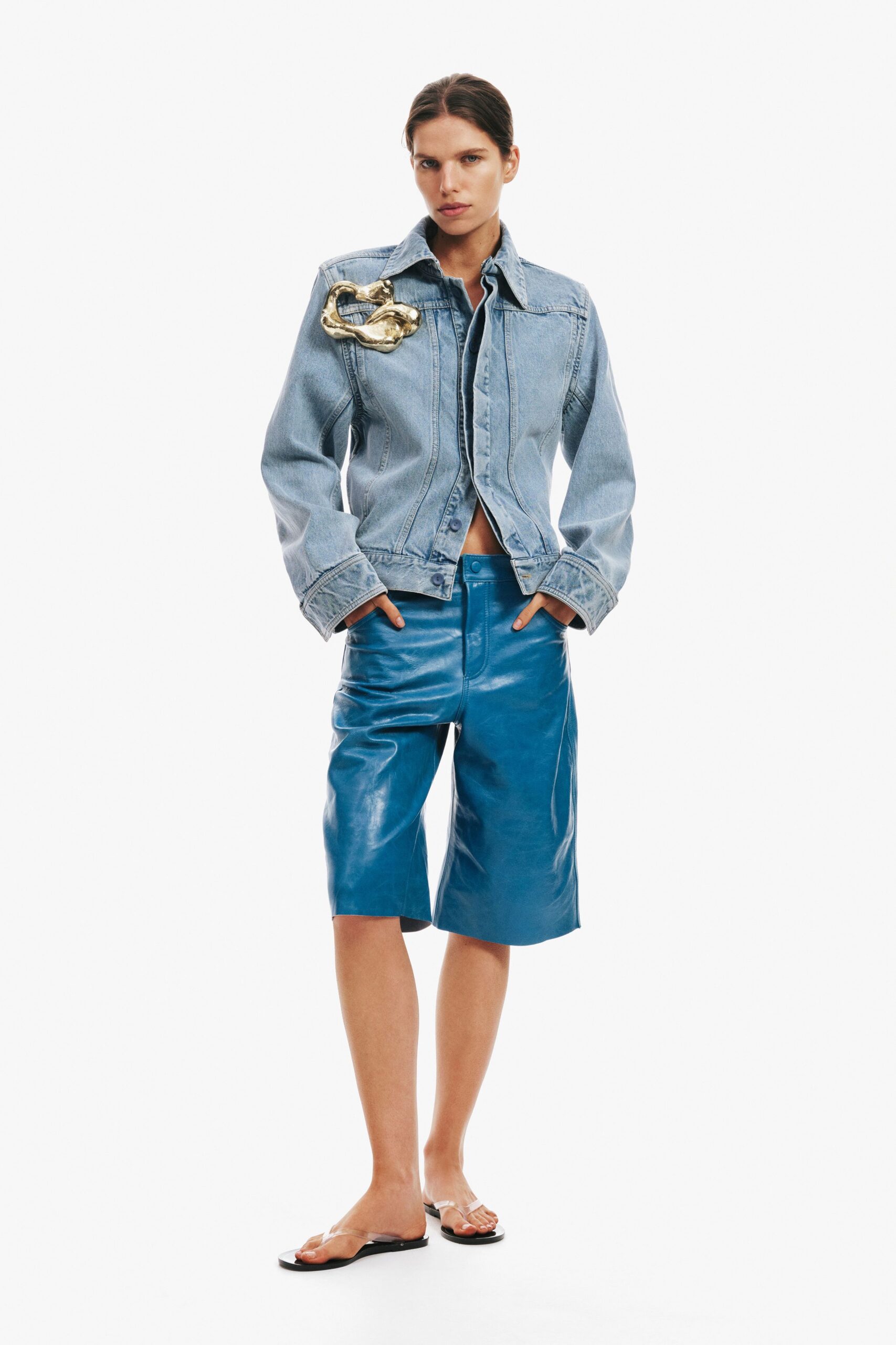 blue denim jacket with leather shorts