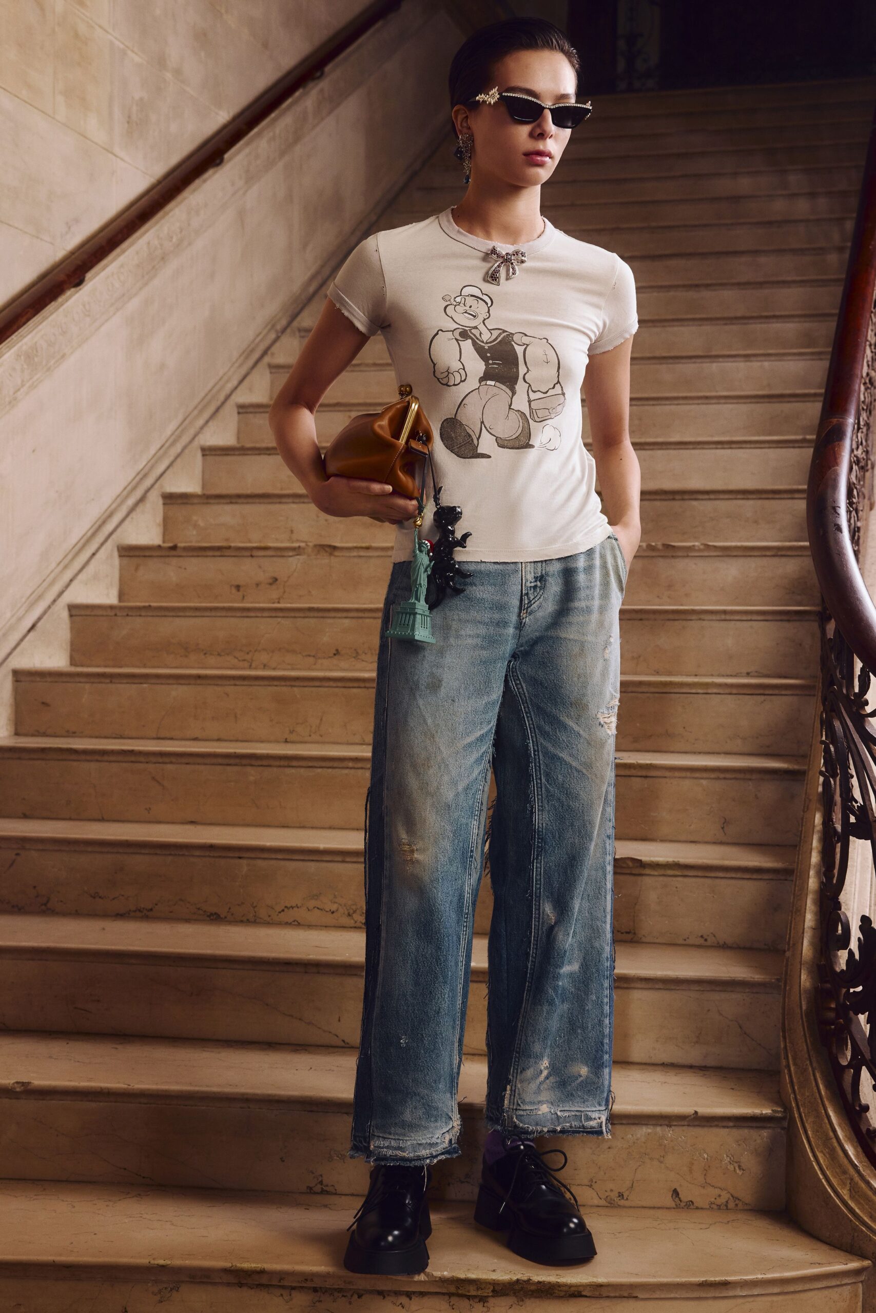 white printed t-shirt and blue jeans