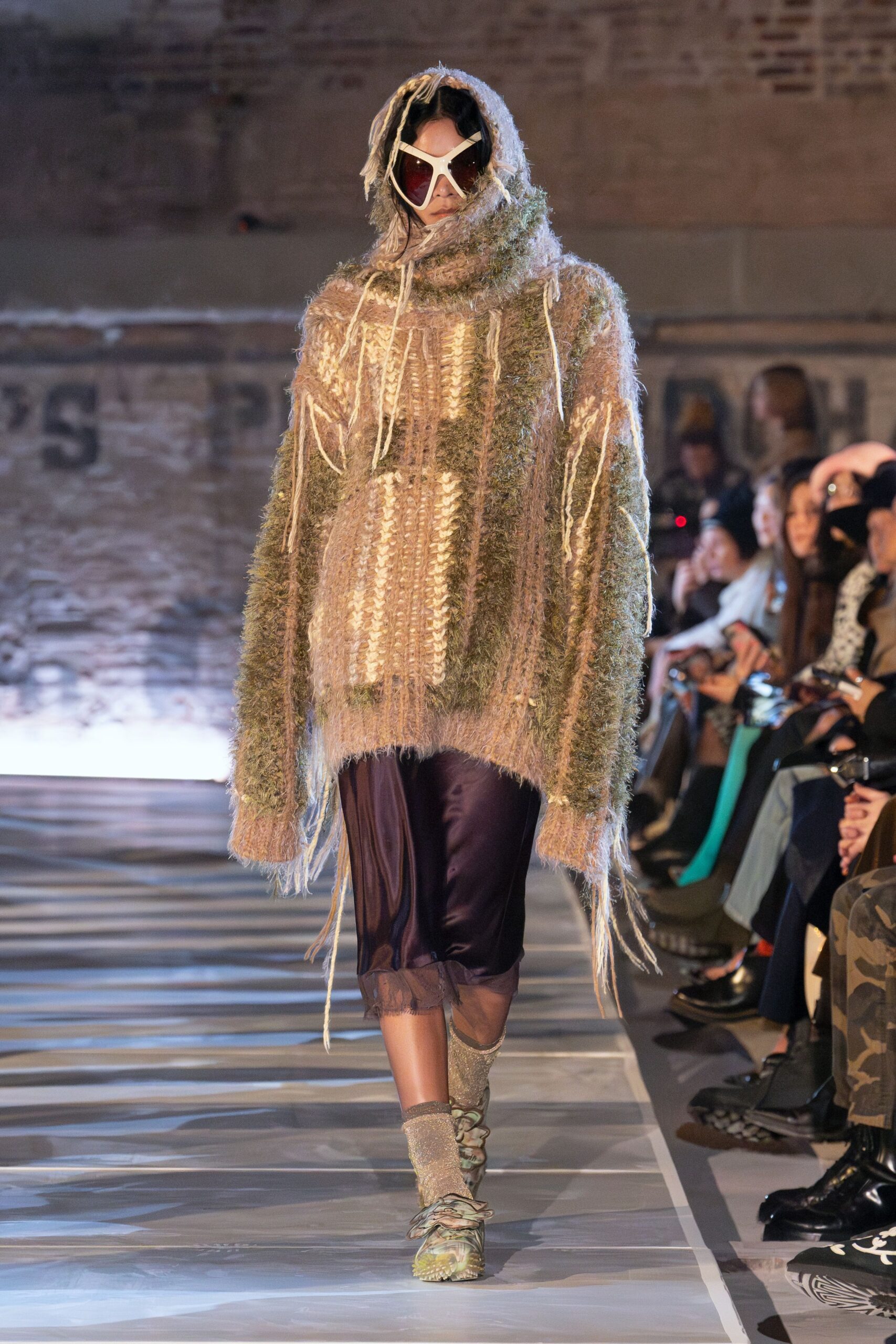 oversized beige sweater with purple pants