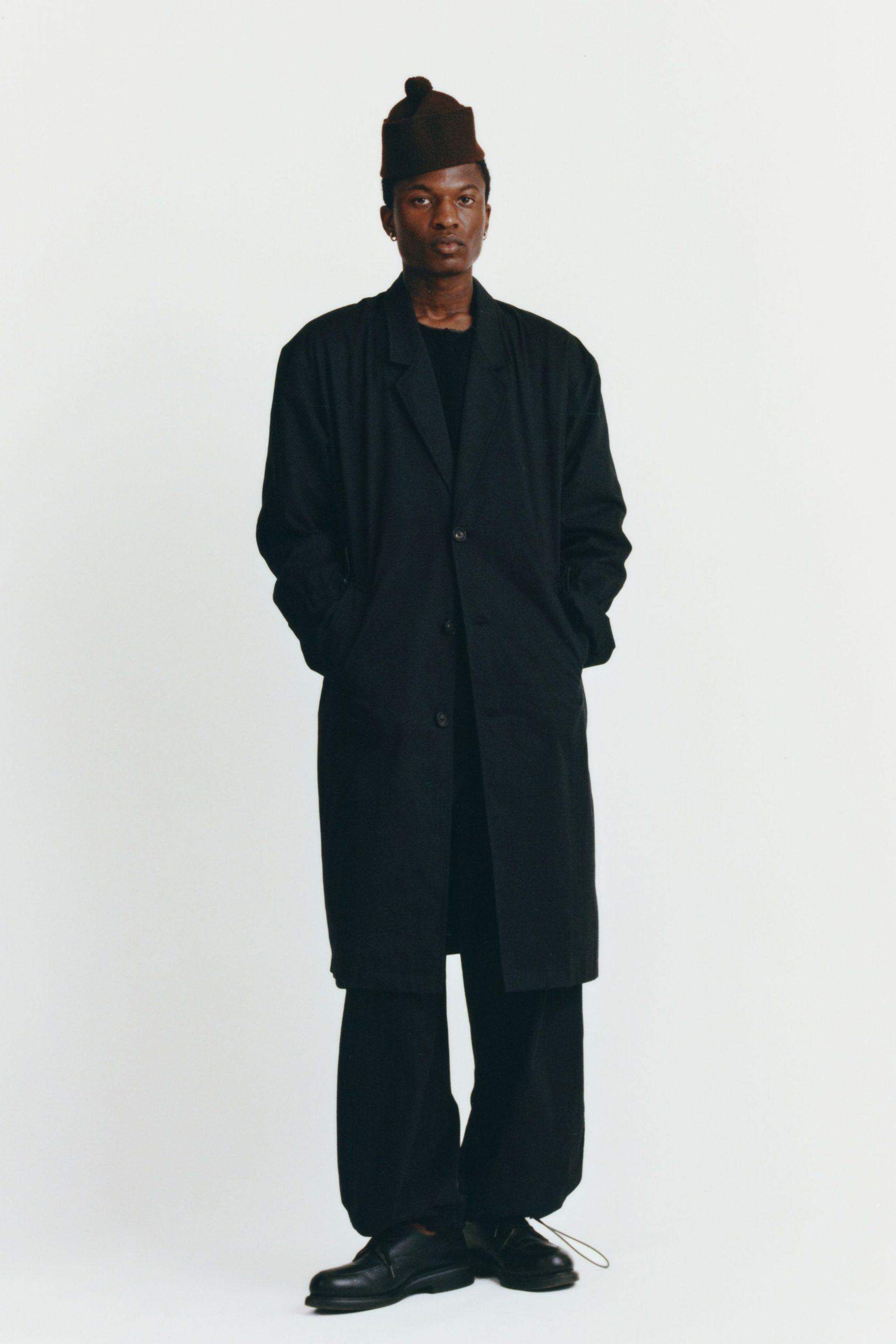 black cotton long-sleeve collared relaxed buttoned maxi coat