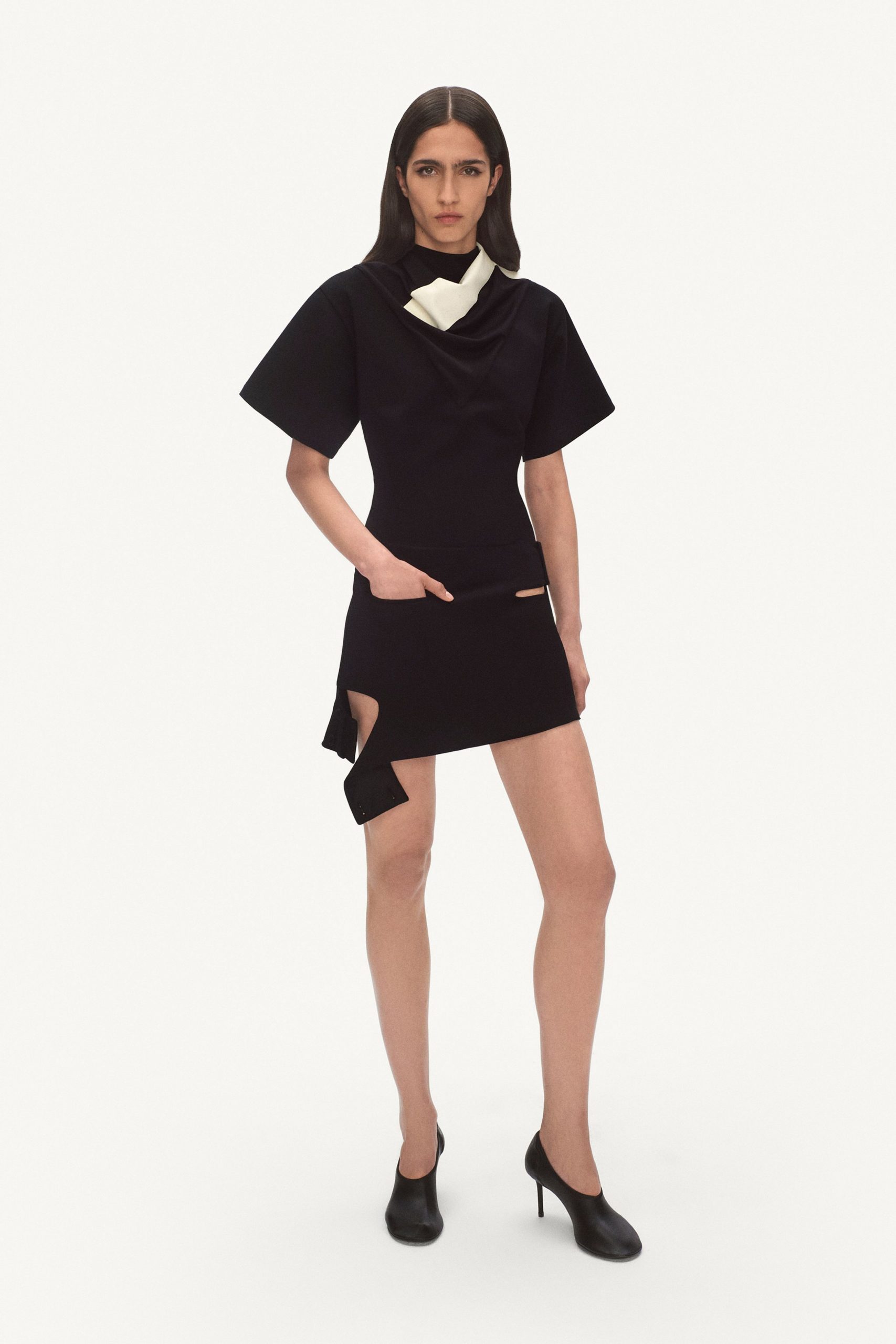 black fitted top and mini skirt