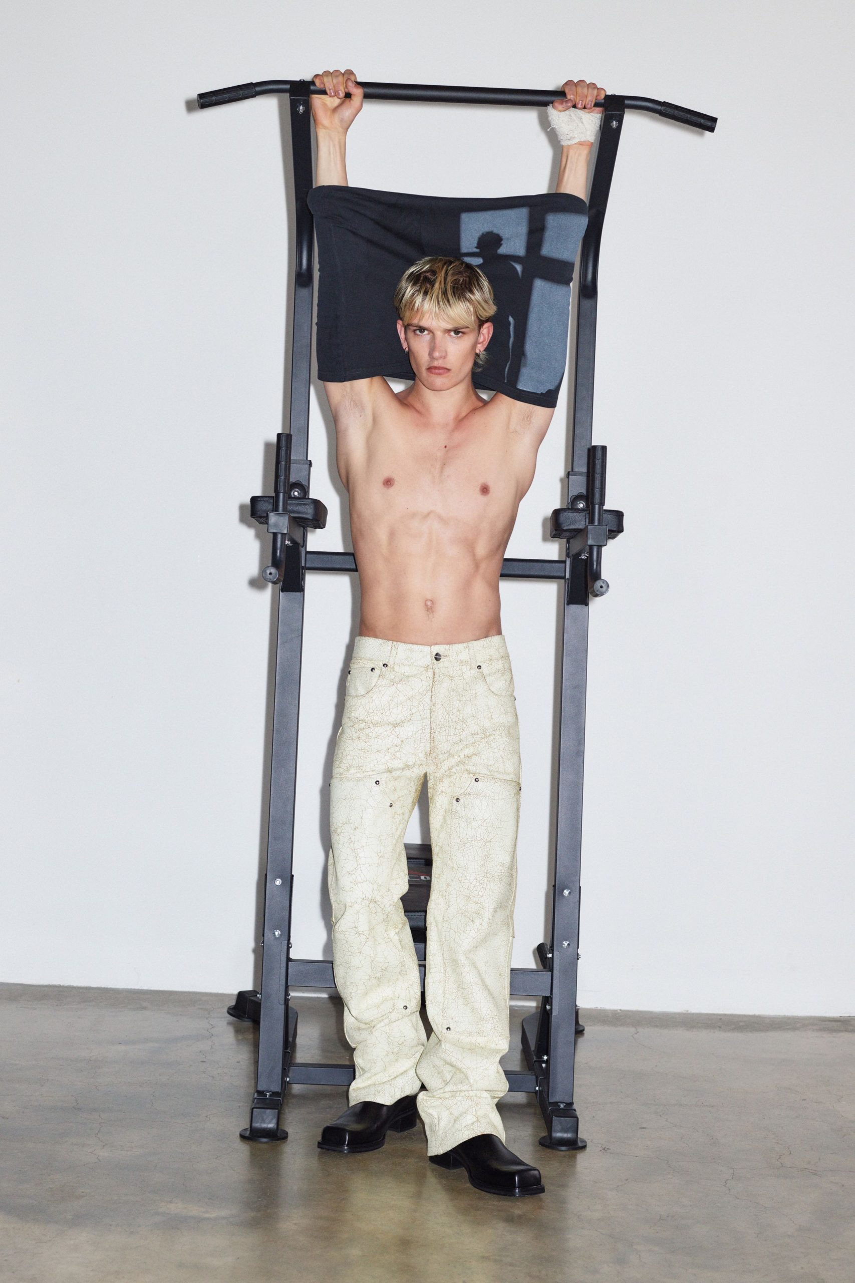 white distressed pants with black shoes