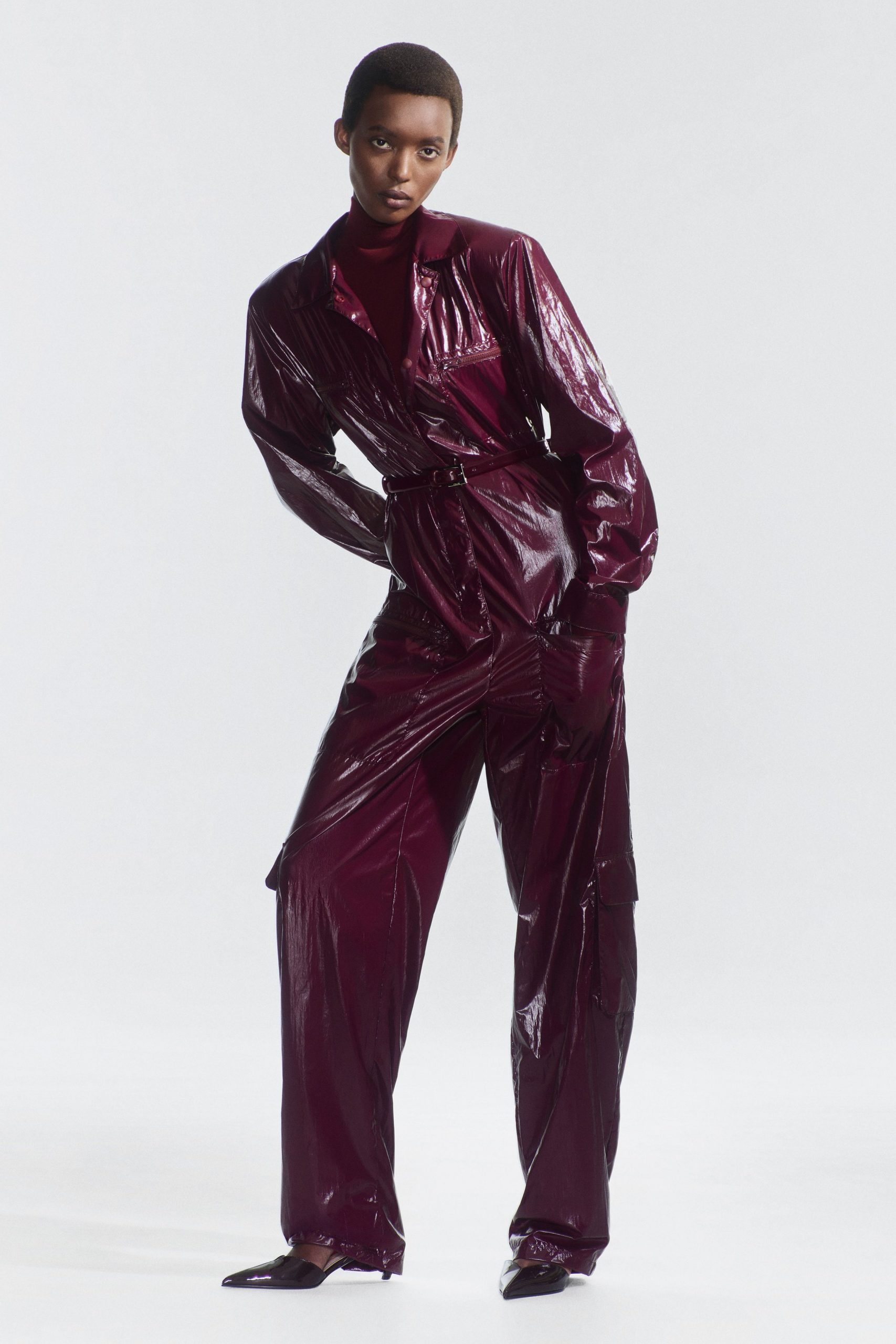 maroon vinyl long-sleeve collared fitted zippered pockets jumpsuit