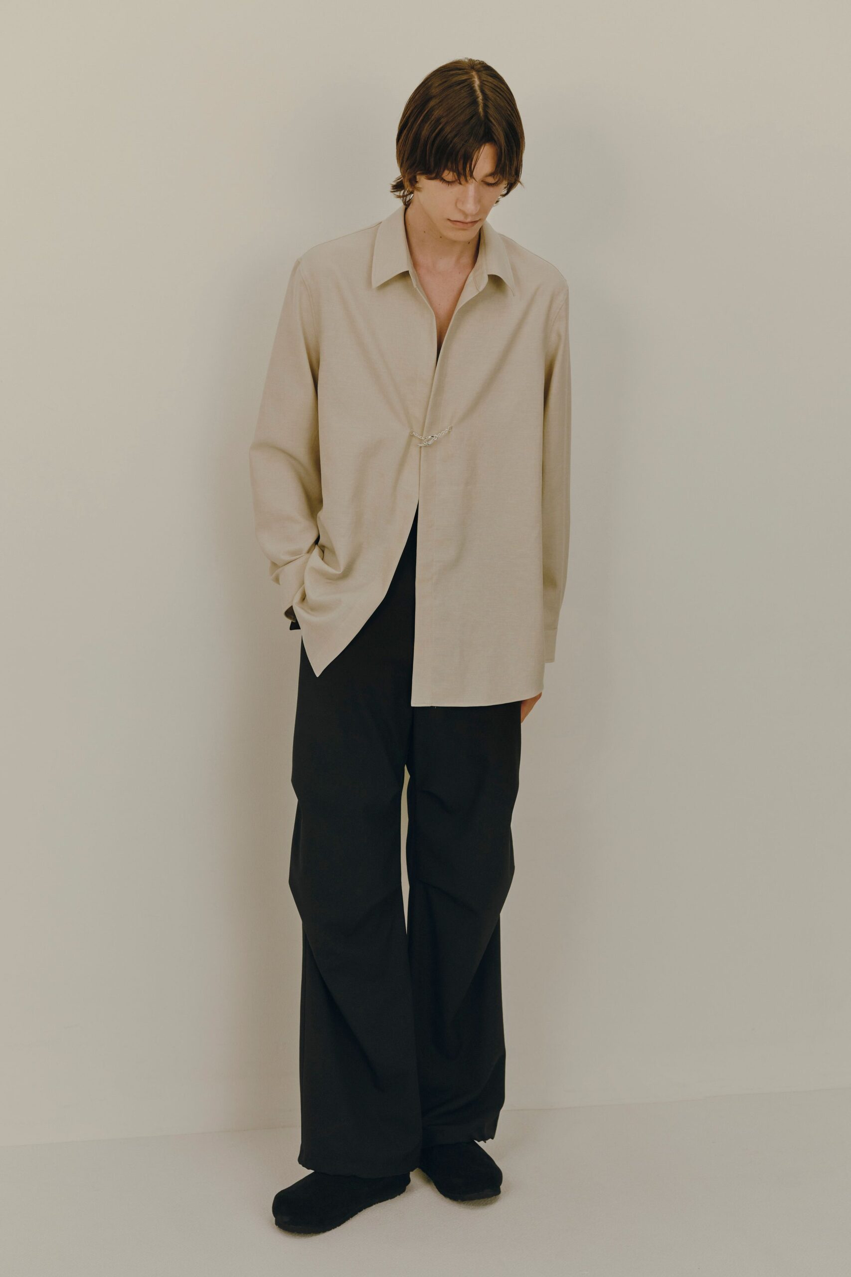beige relaxed shirt with black pants