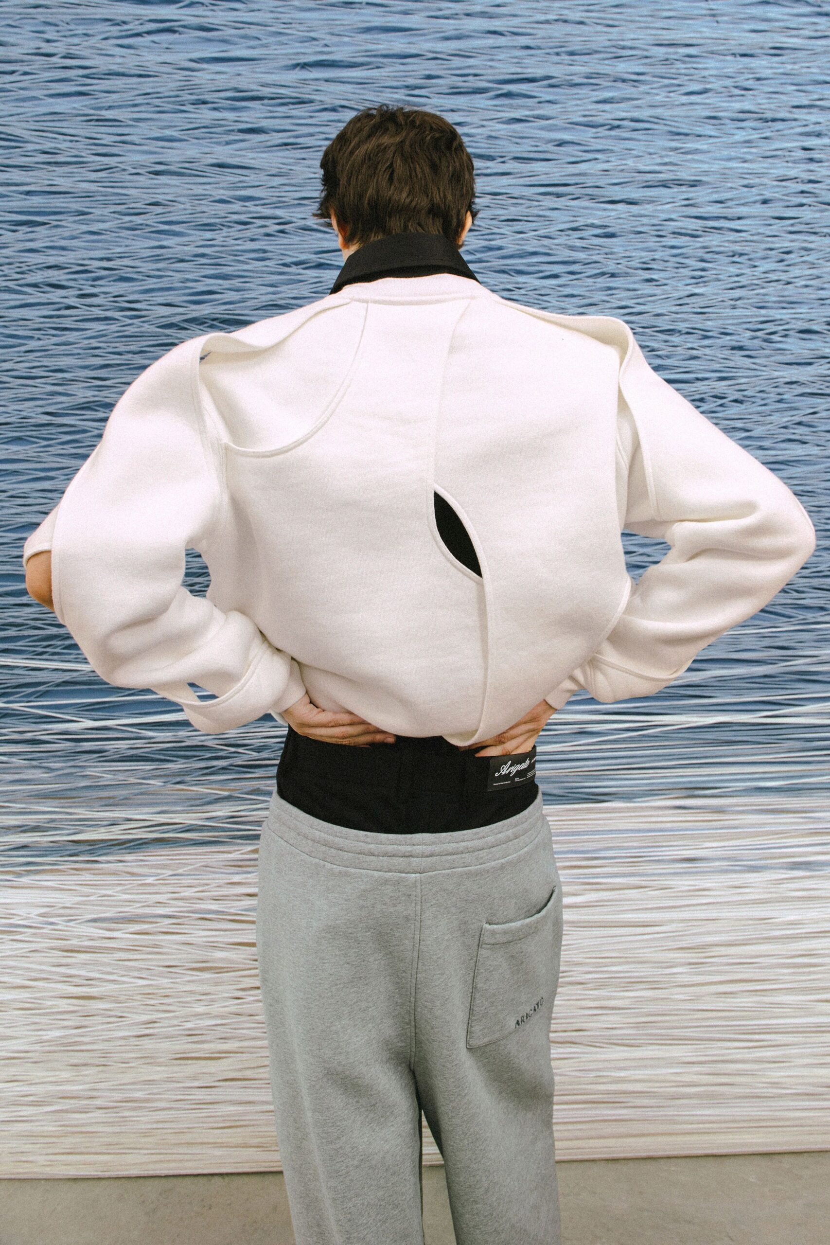 white relaxed jacket gray pants
