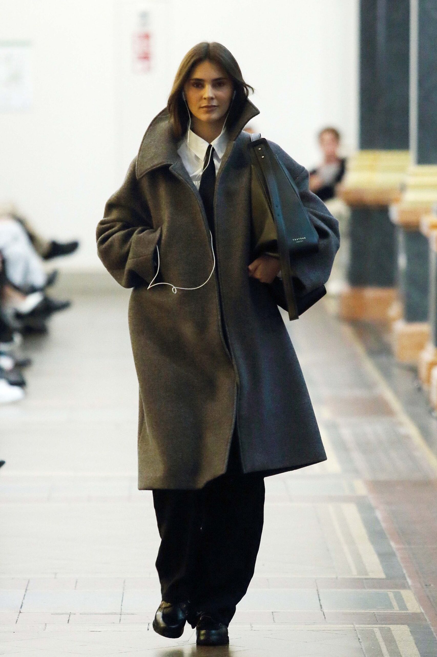 gray wool coat with black pants