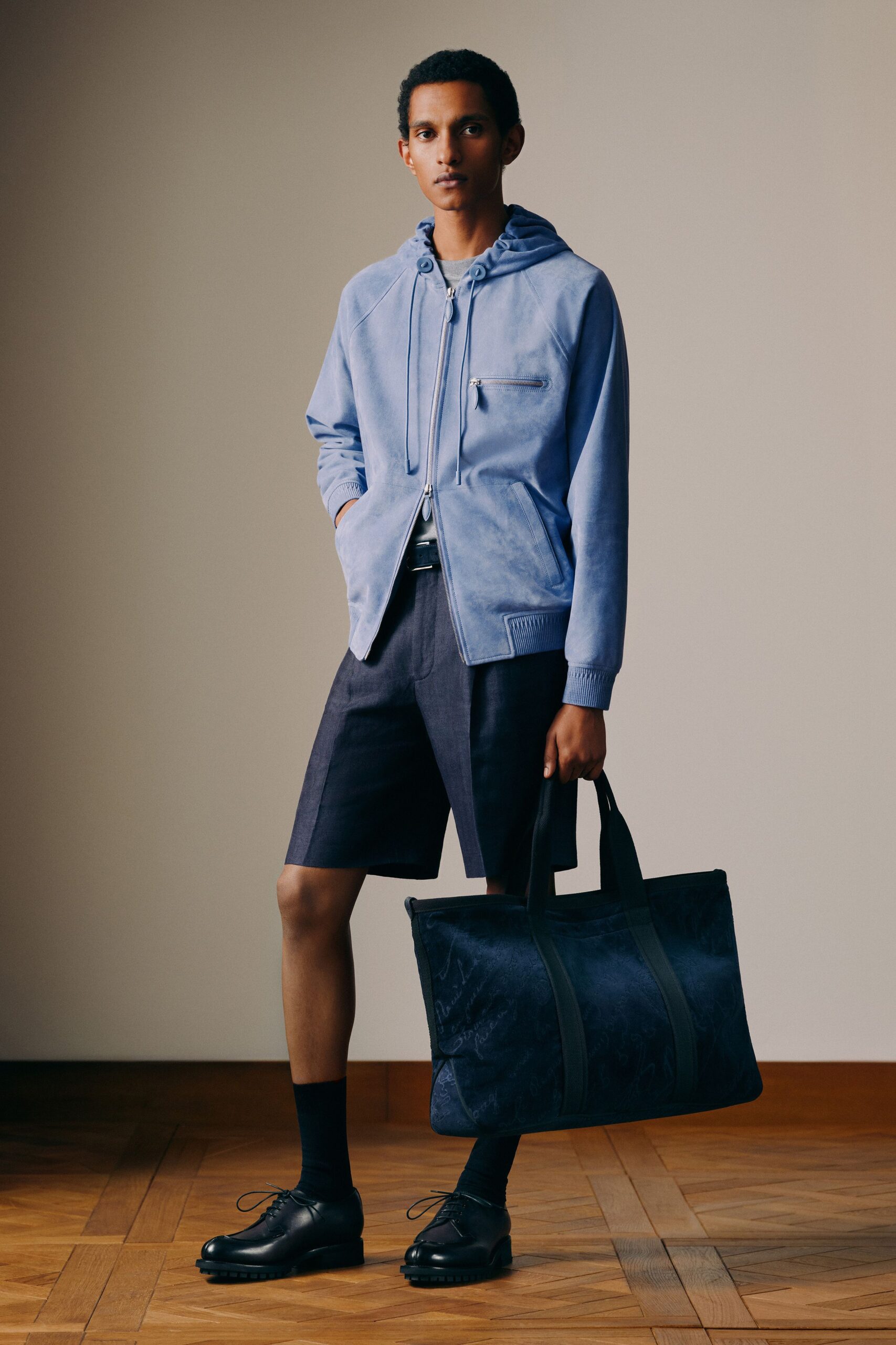 blue suede hoodie with black shorts