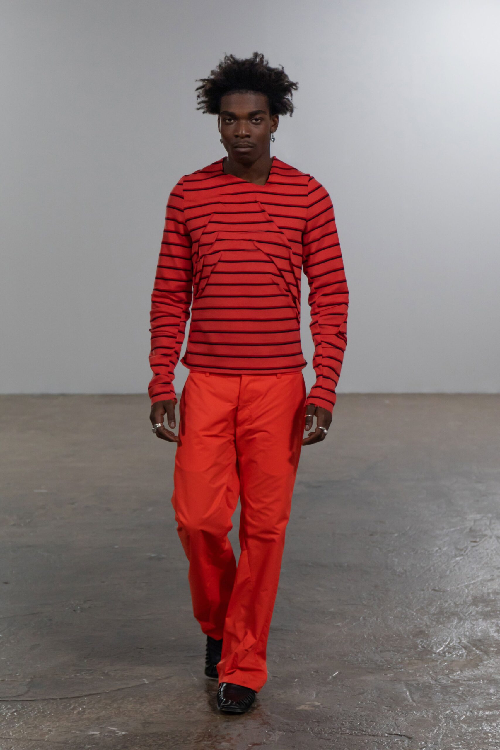 red striped top with orange pants