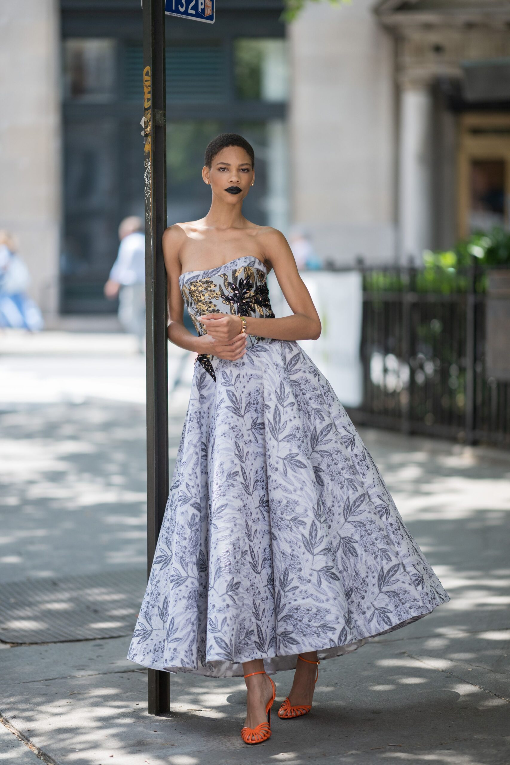 white silk sleeveless off-shoulder fitted floral pleated gown