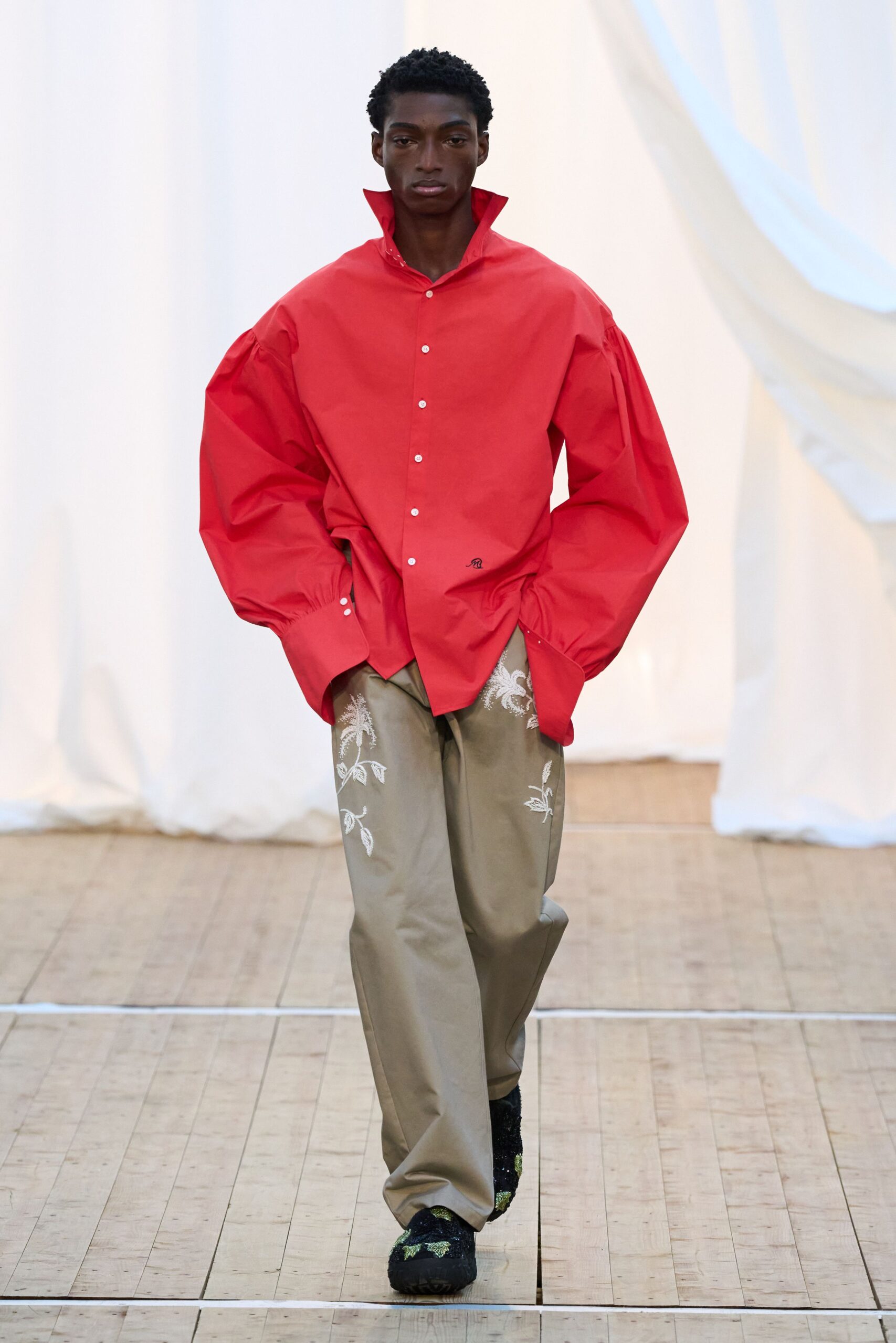 oversized red shirt with beige pants