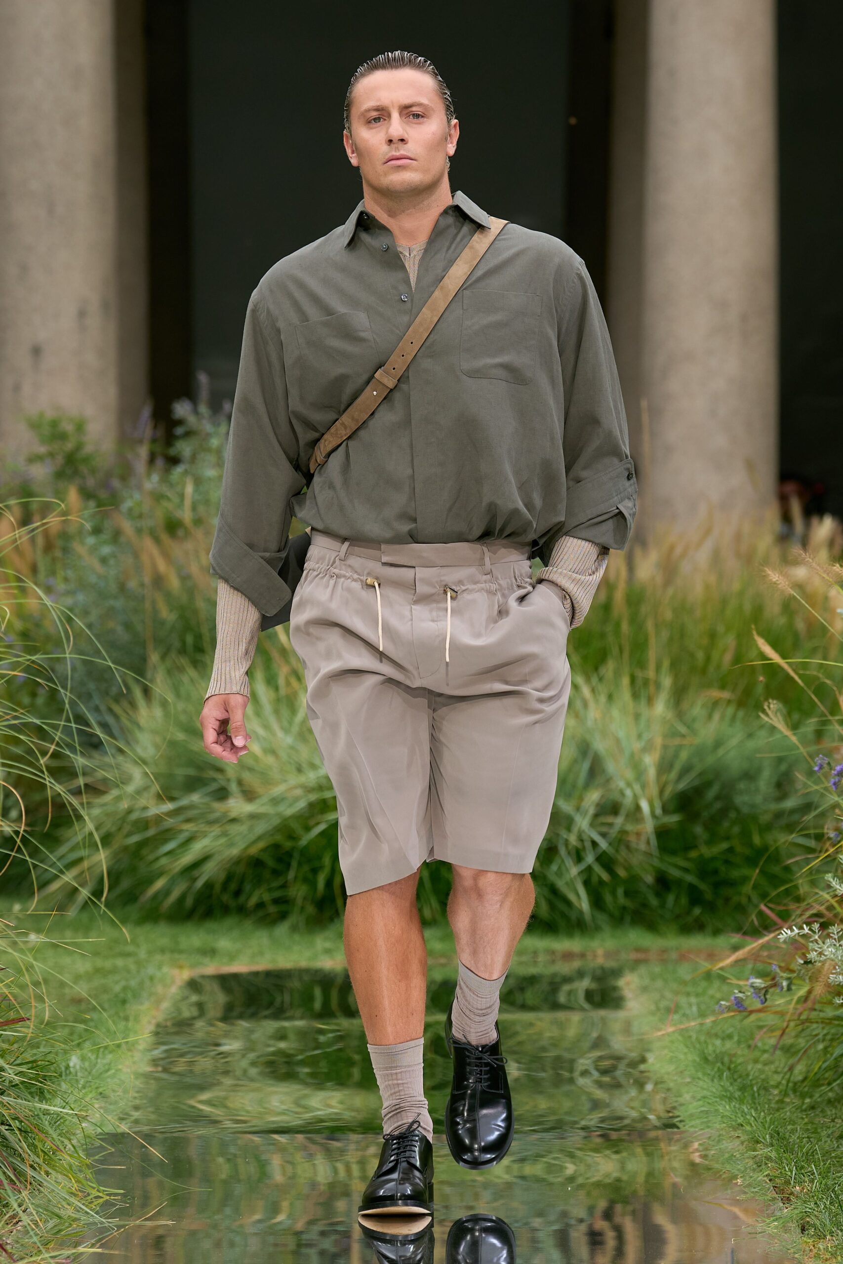 green relaxed shirt with beige shorts