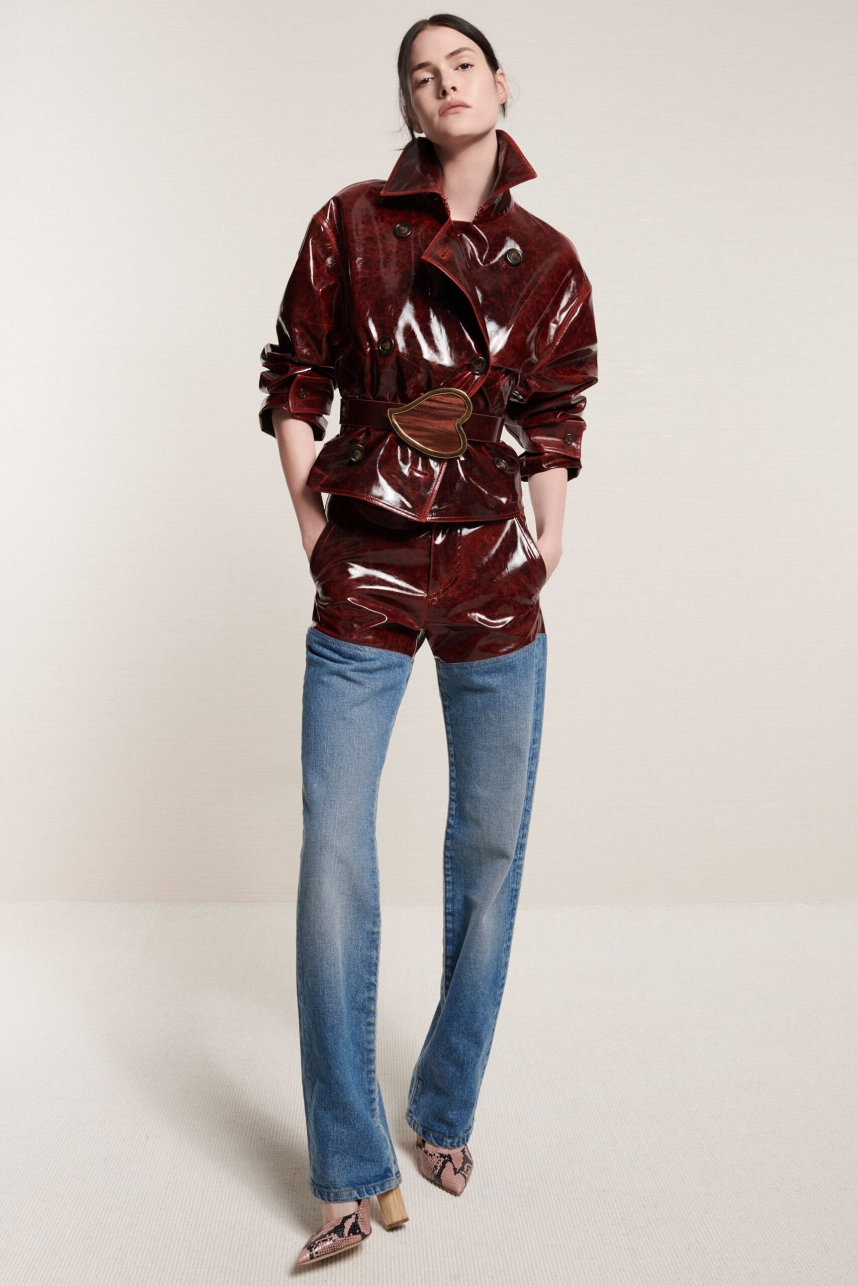 red vinyl long-sleeve collared fitted zippered belted jacket