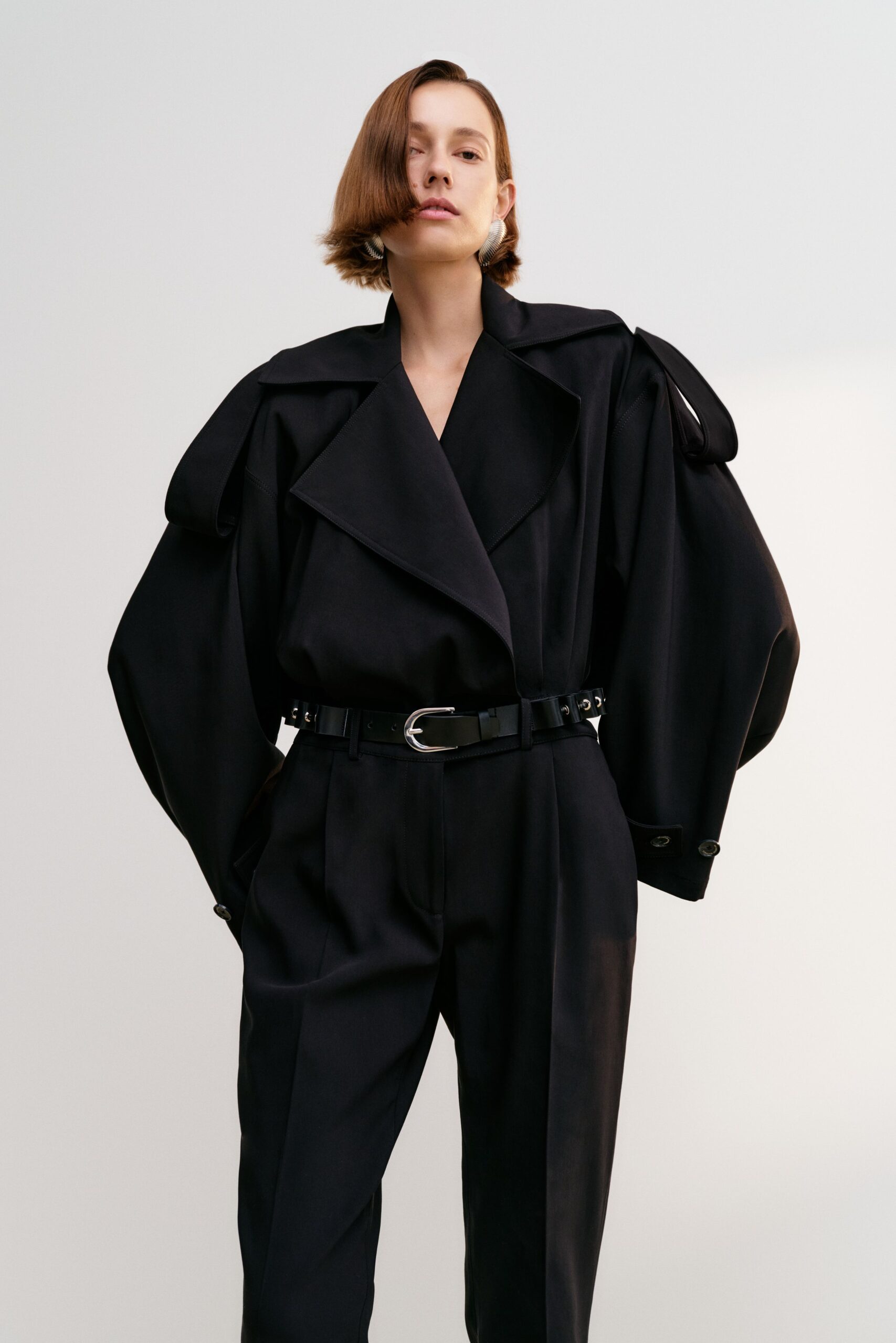 black wool long-sleeve collared oversized draped pockets jacket