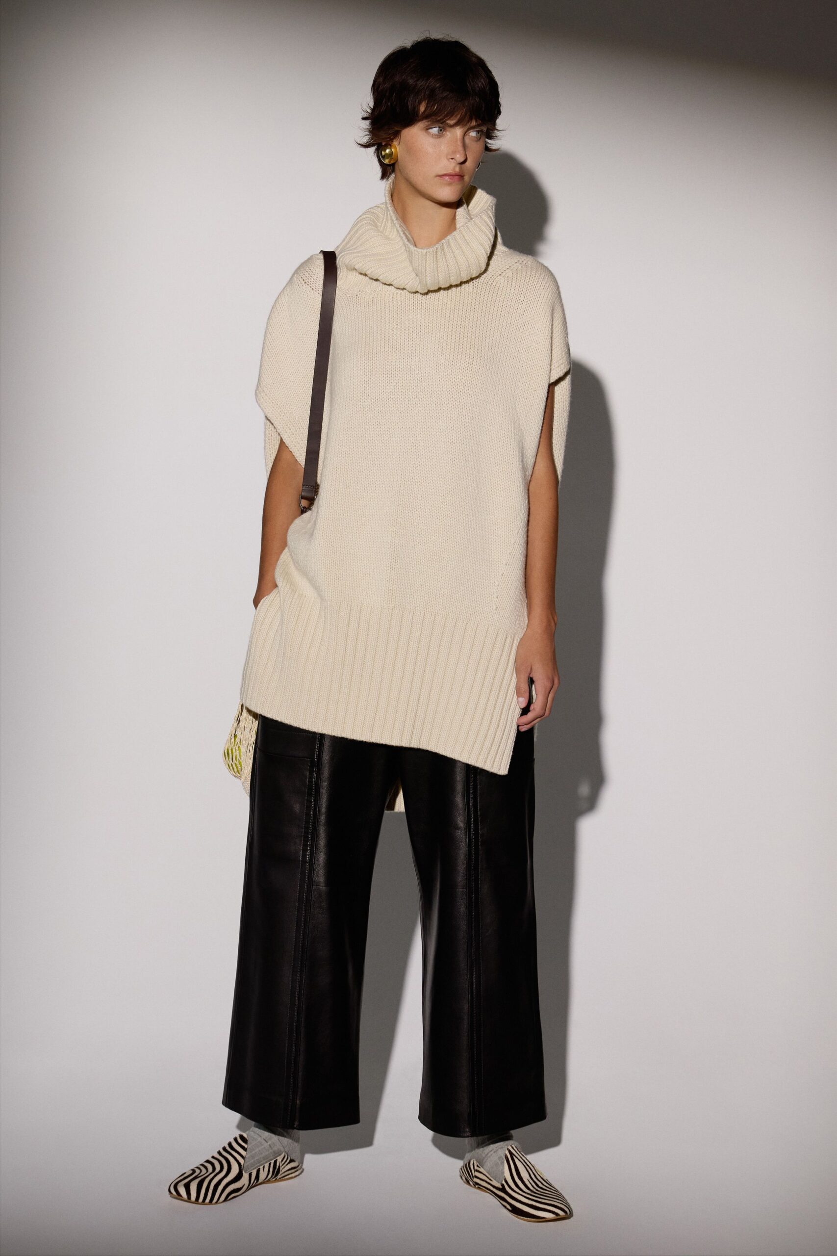 beige relaxed top with black pants
