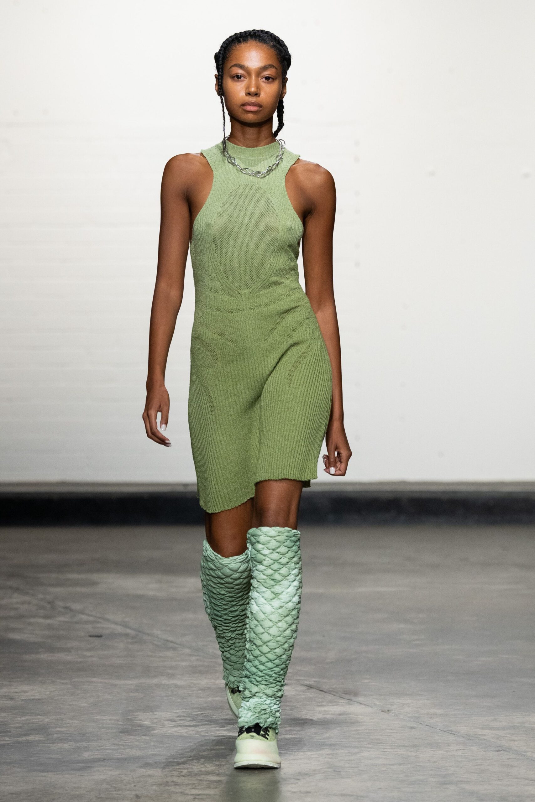 green fitted mini dress with boots