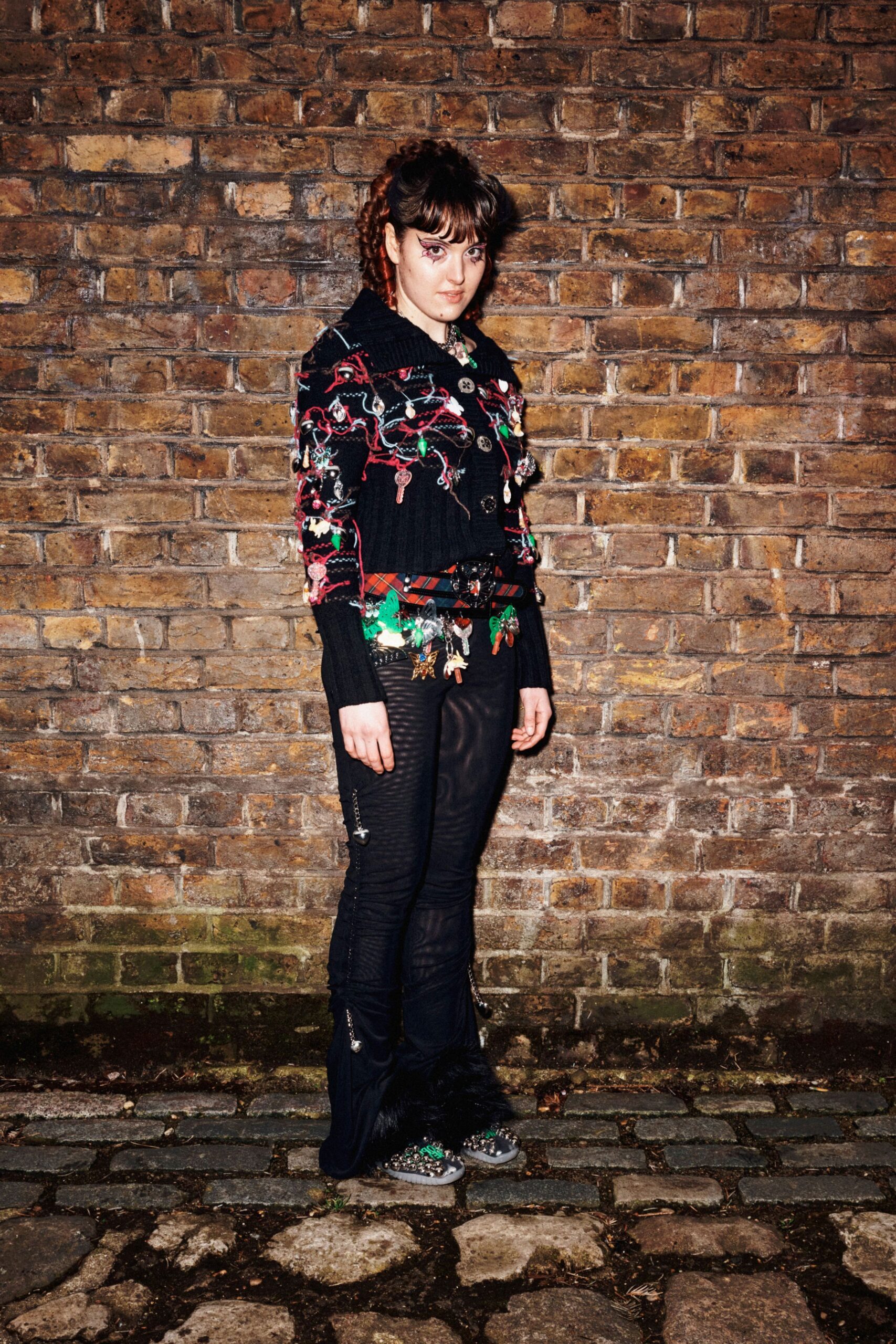 black embroidered jacket with distressed pants
