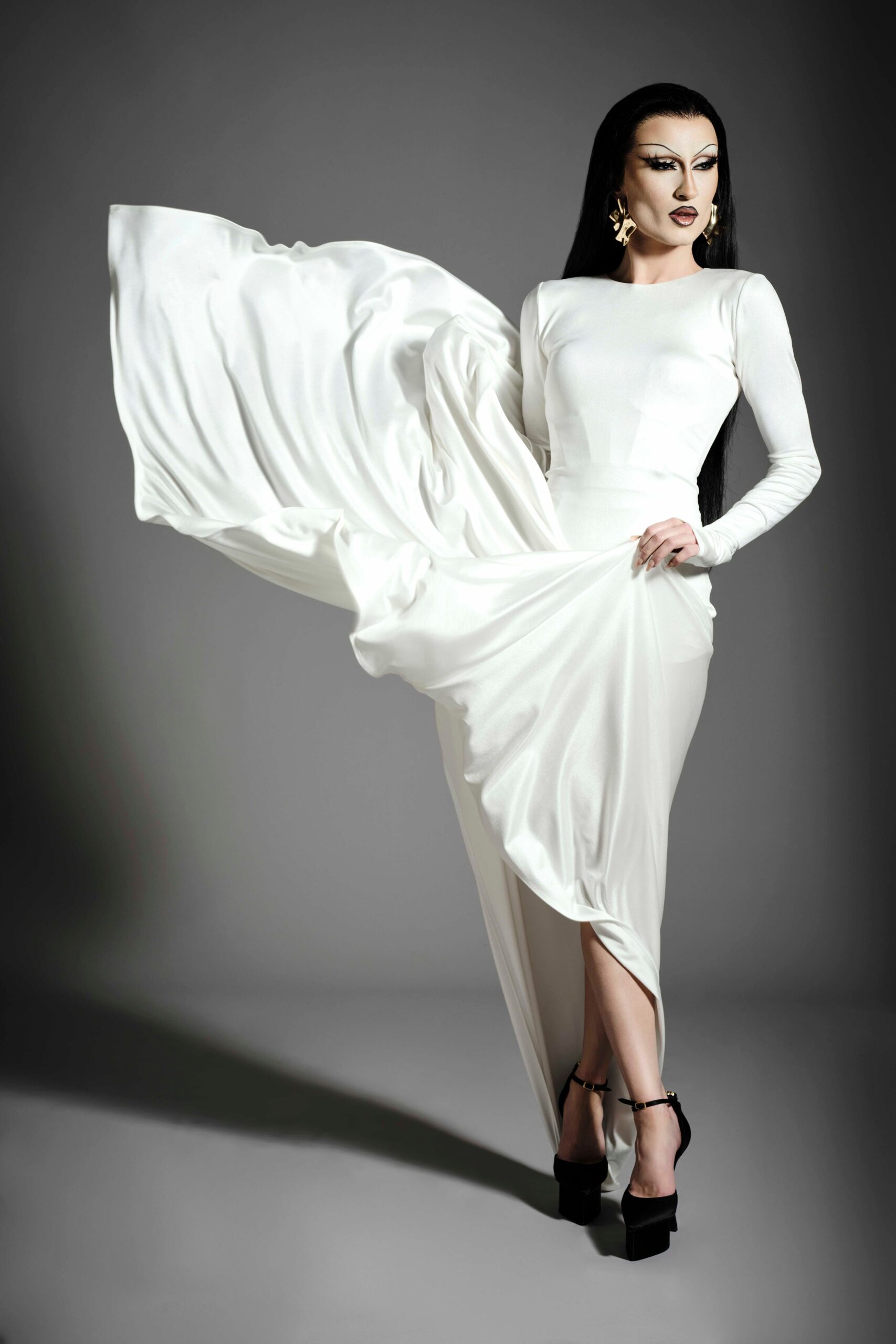 white silk fitted gown with heels