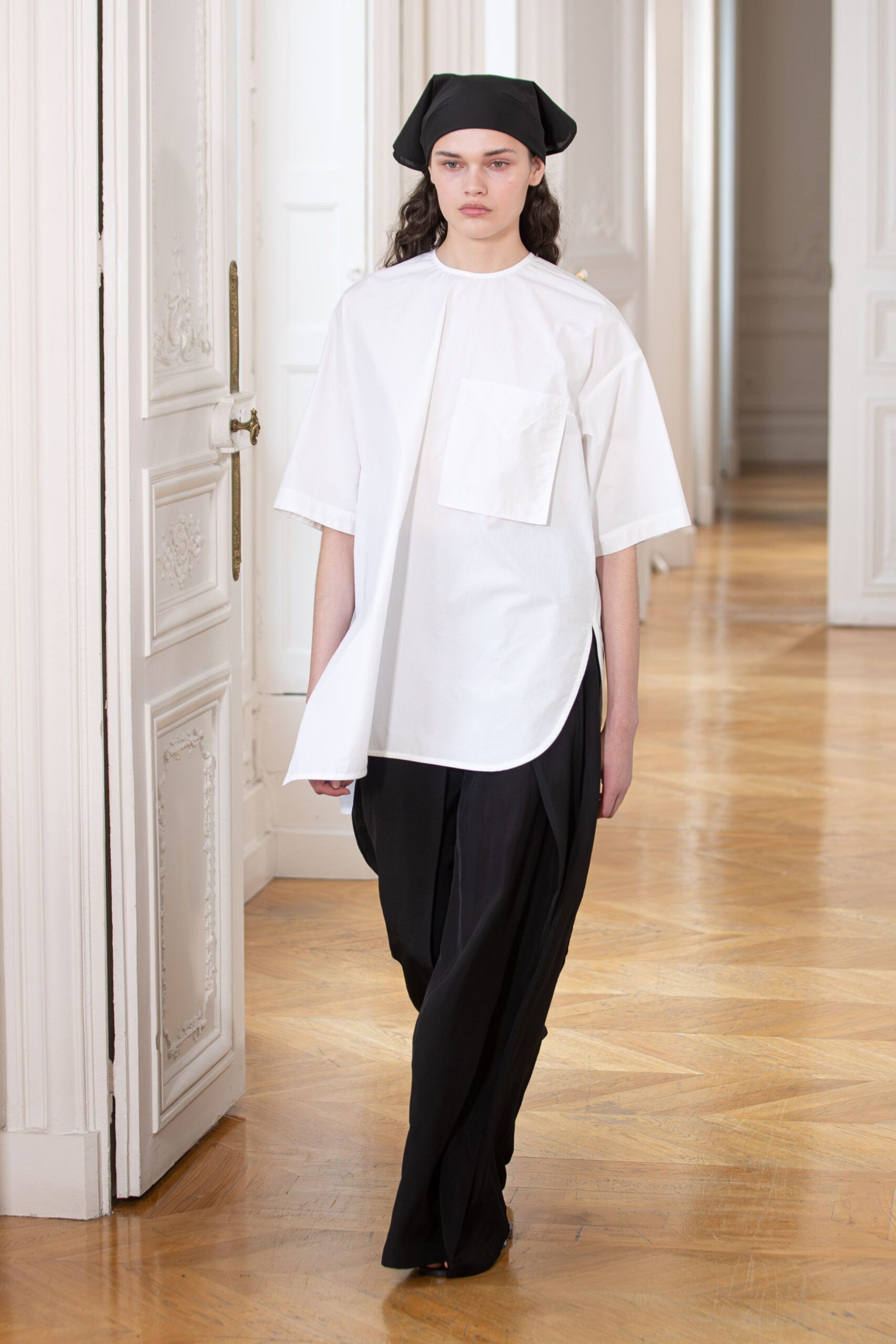 white relaxed shirt black wide-leg pants