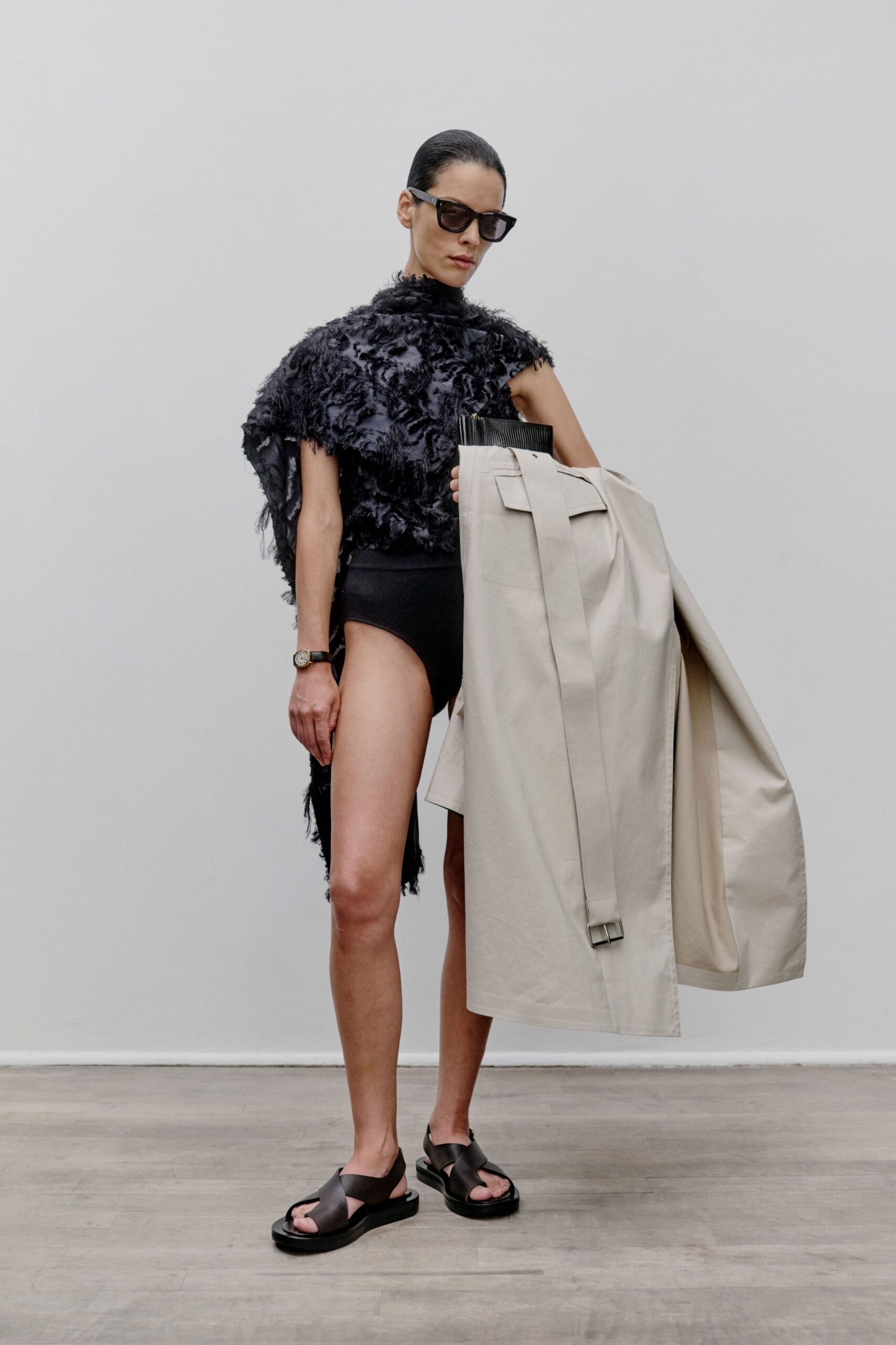 black fringed top beige trench