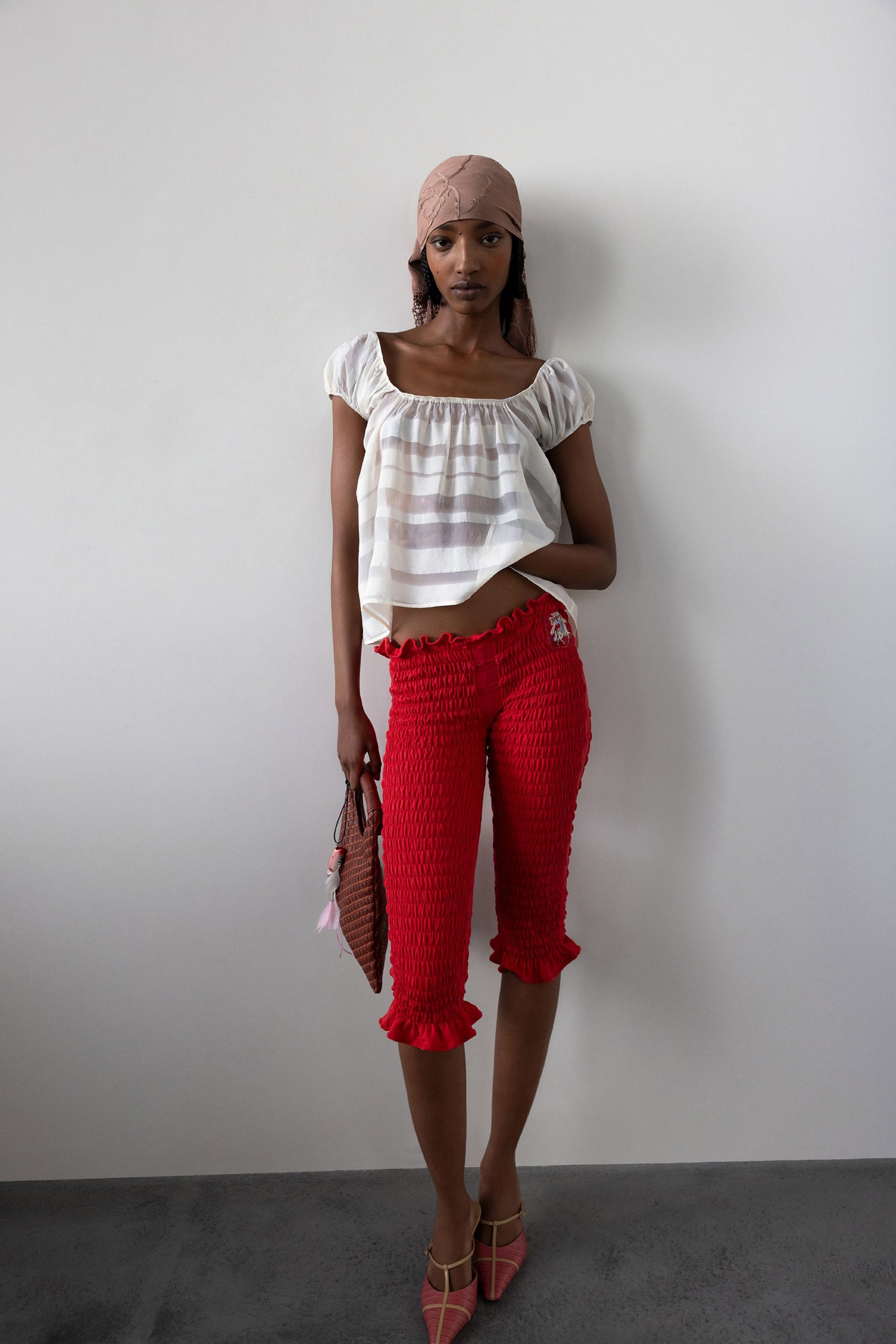 white top red pants pink shoes