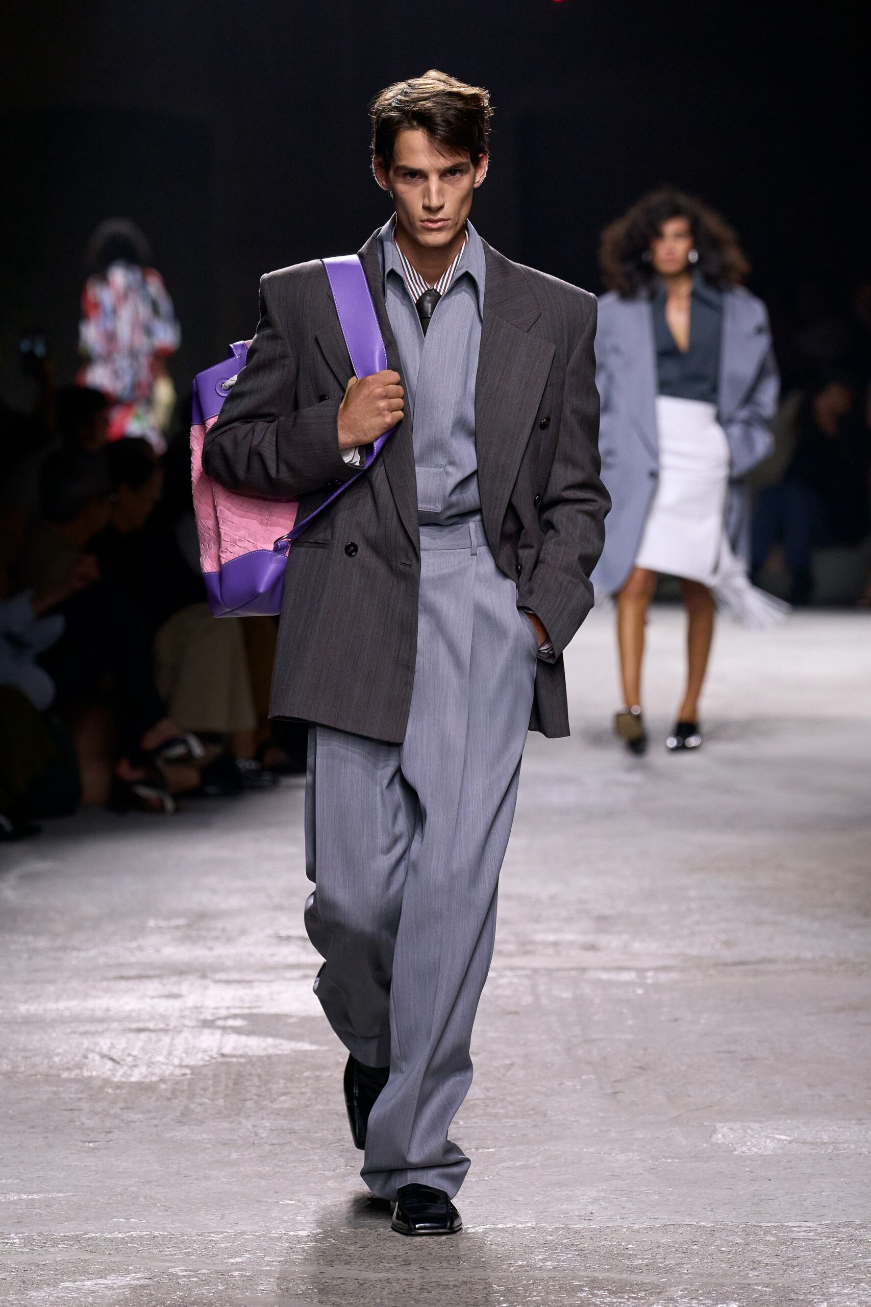gray tailored suit with bag