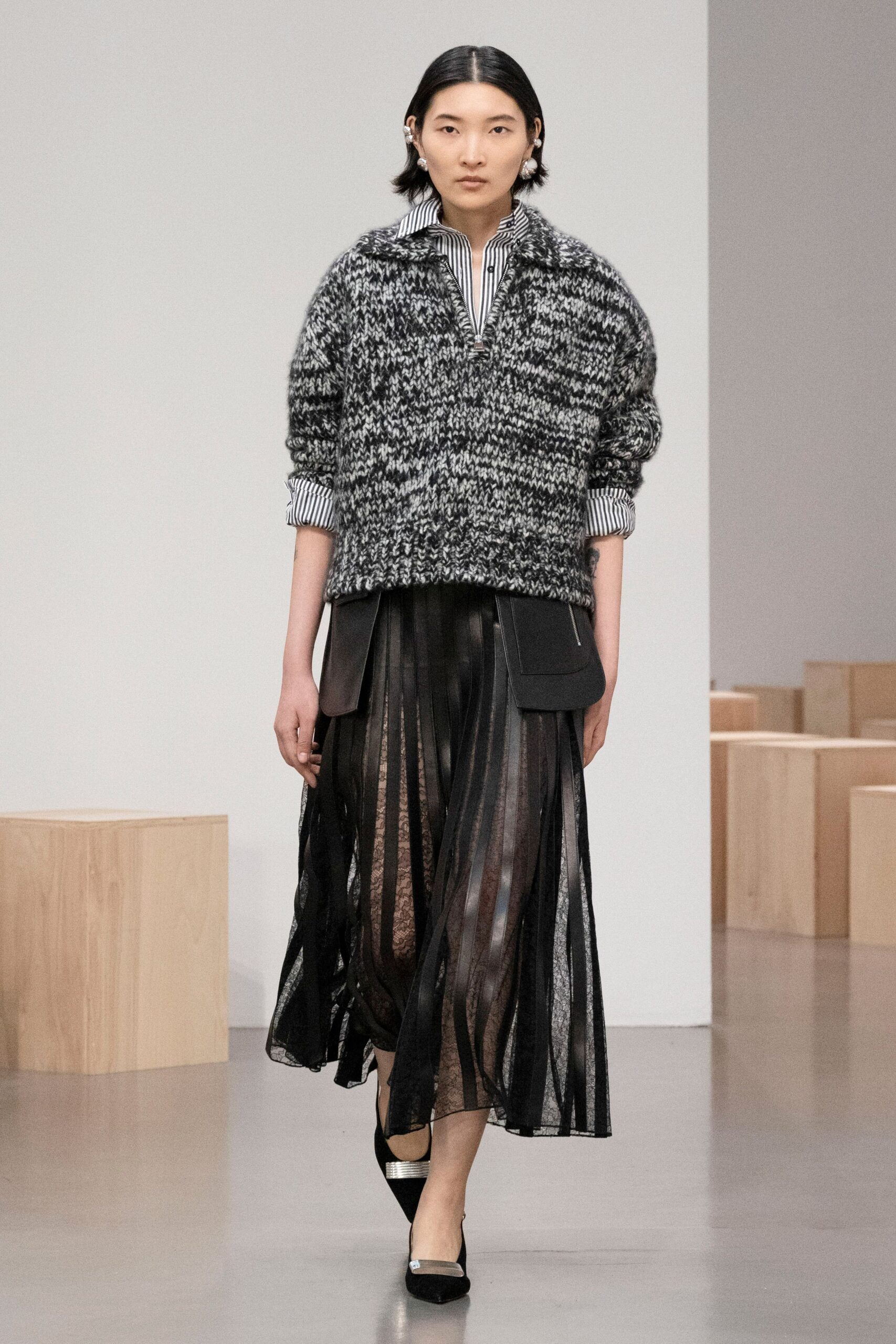 black and white relaxed sweater with pleated skirt