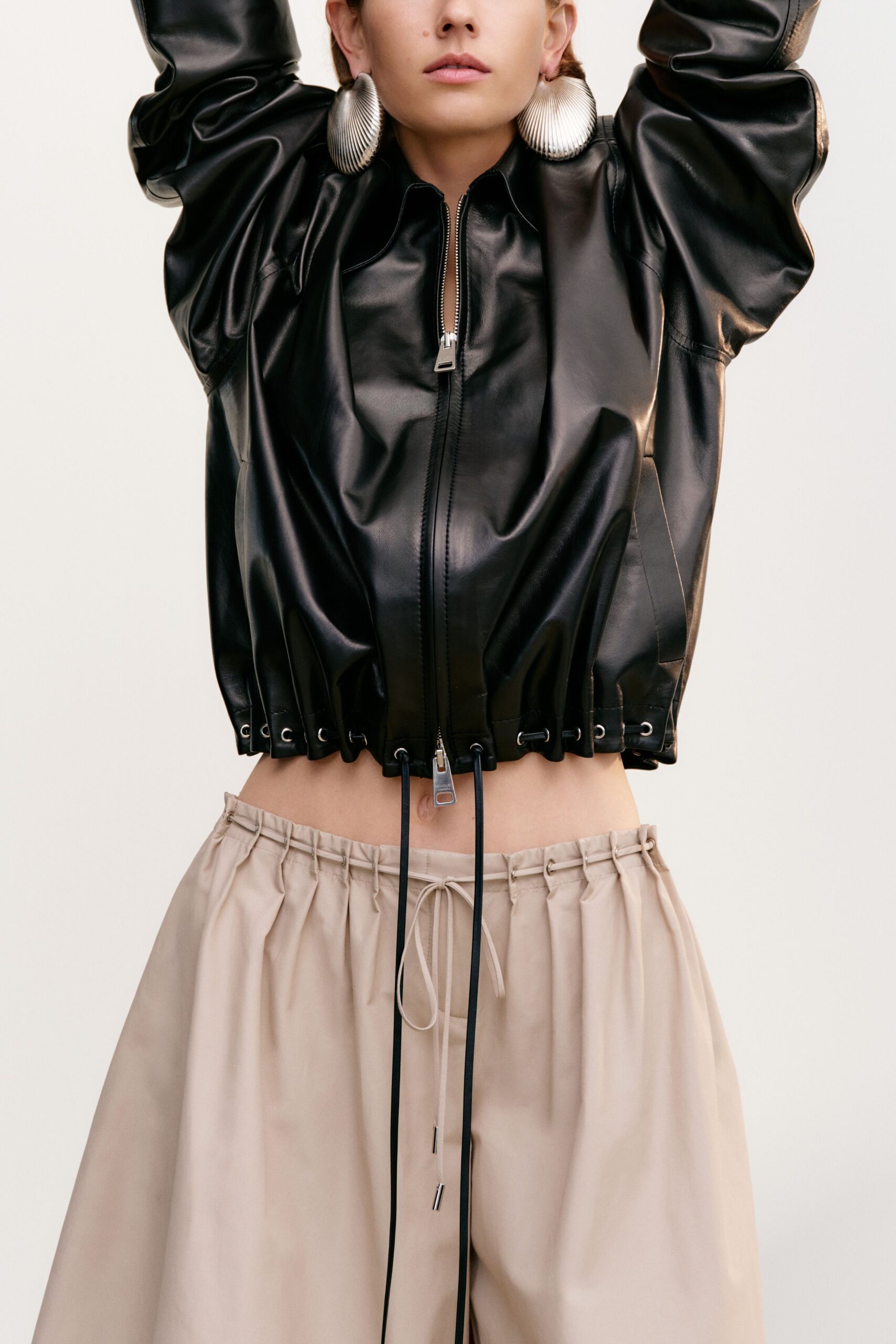 black leather long-sleeve collared oversized zippered pockets jacket