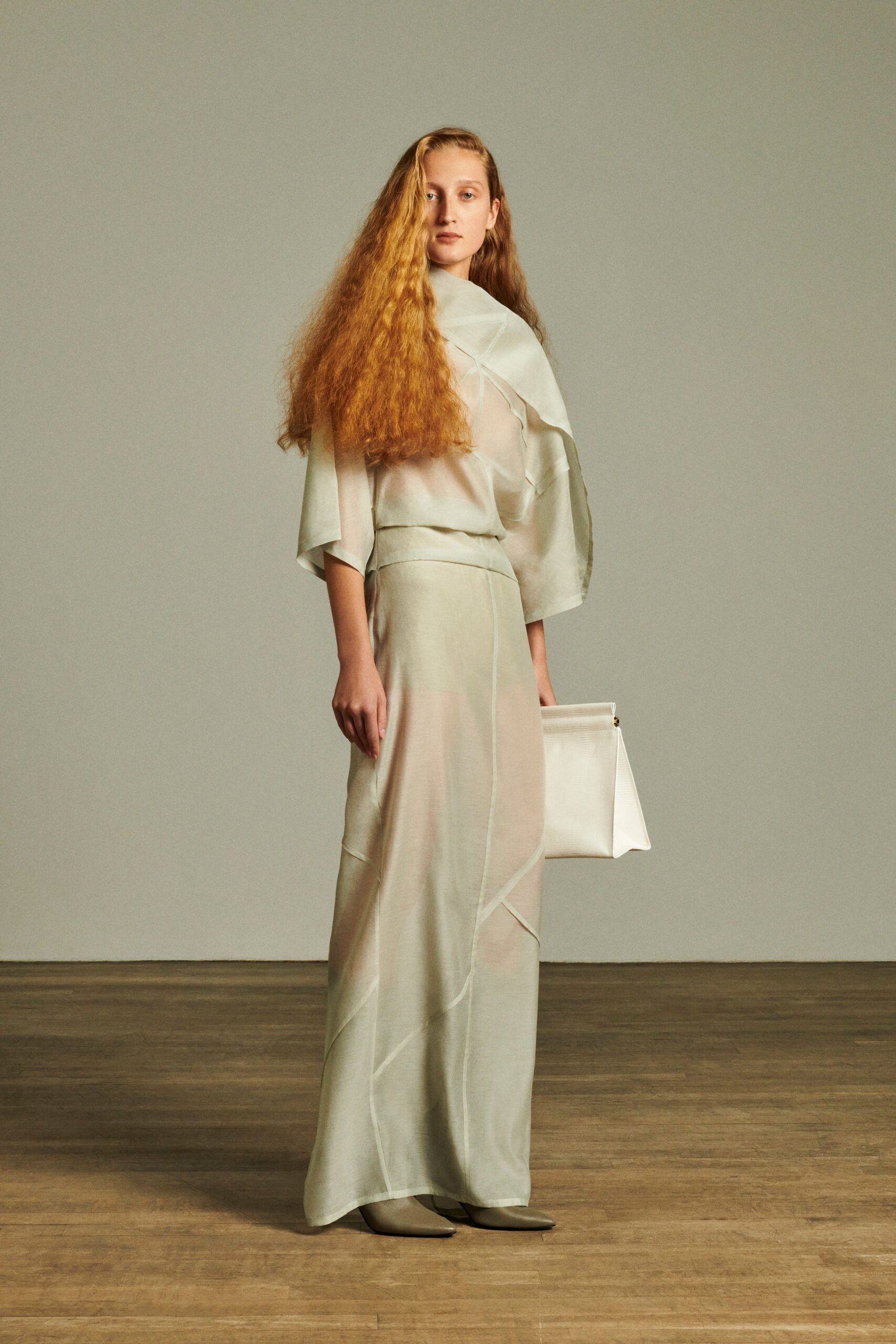 gray silk sleeveless high-neck fitted draped flowing dress