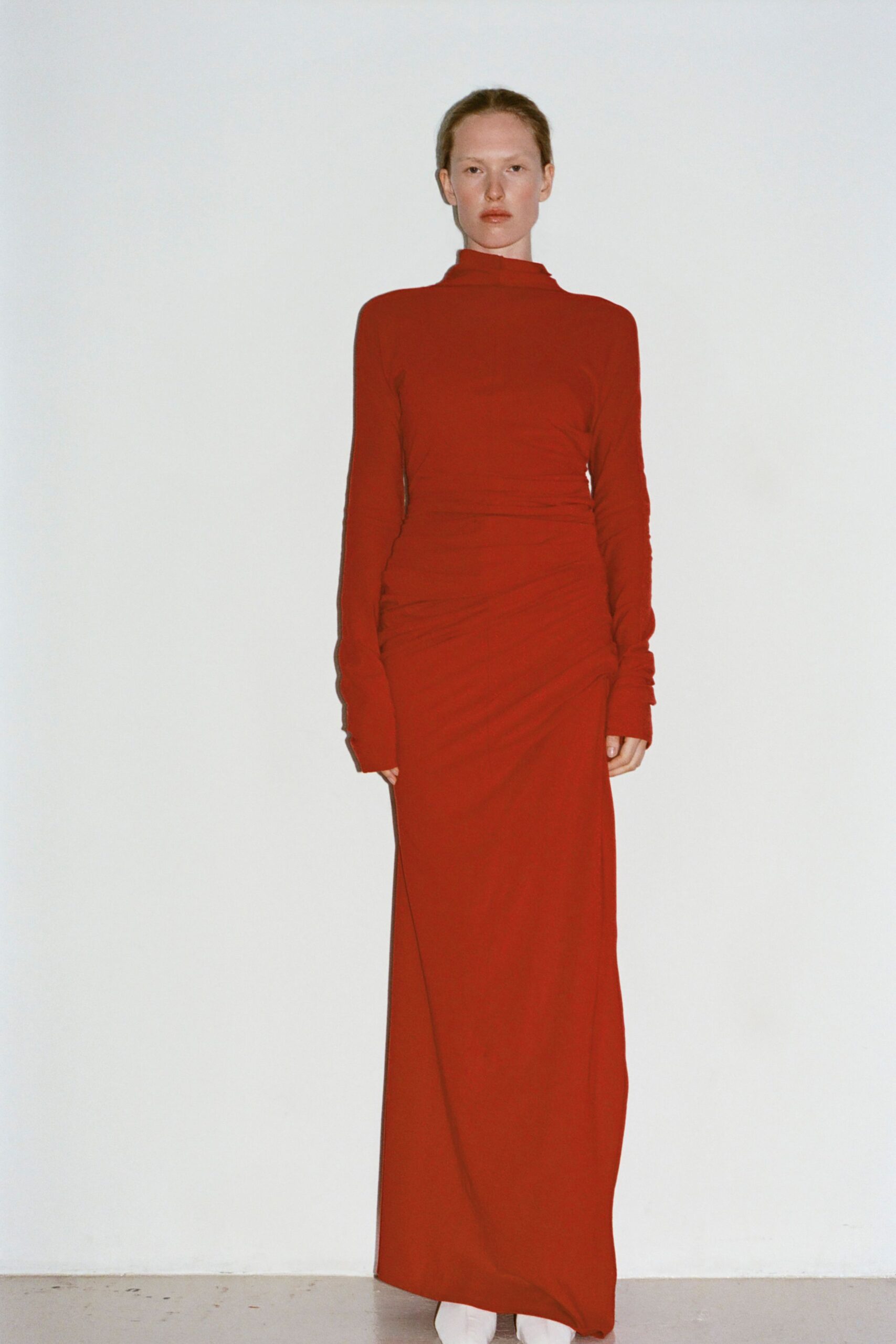 red fitted long-sleeve gown