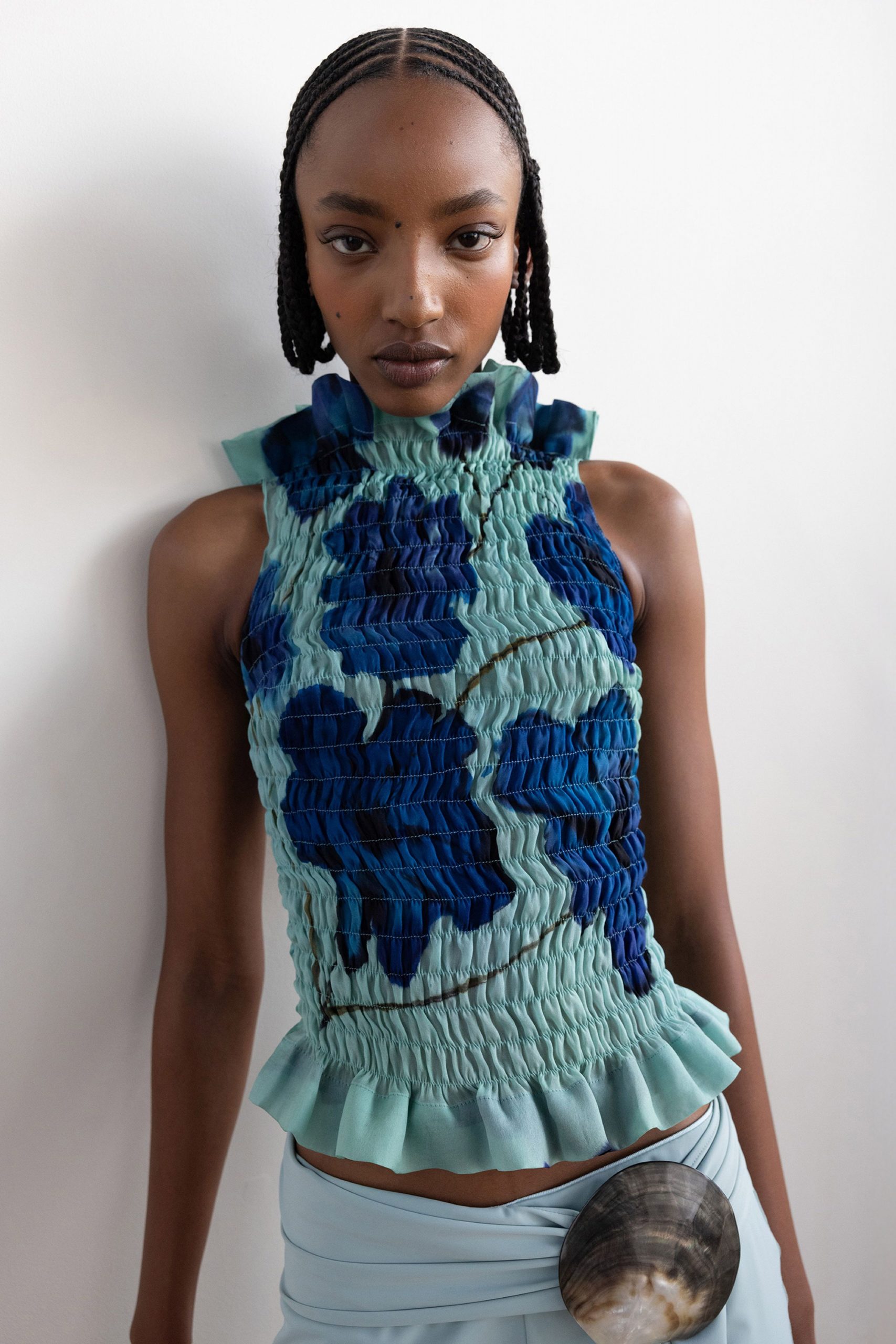 blue green ruffled top with draped skirt