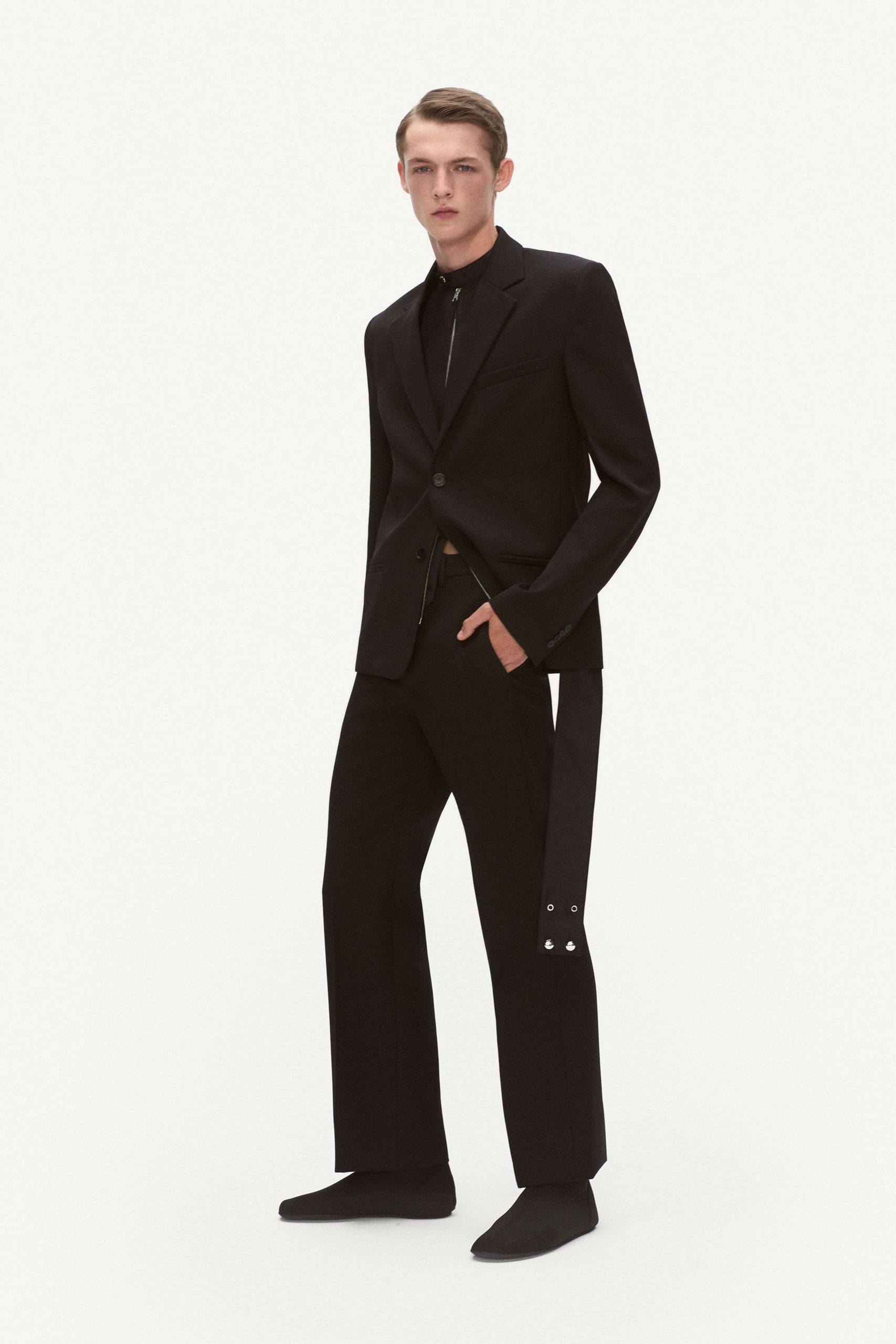 black tailored blazer and relaxed pants