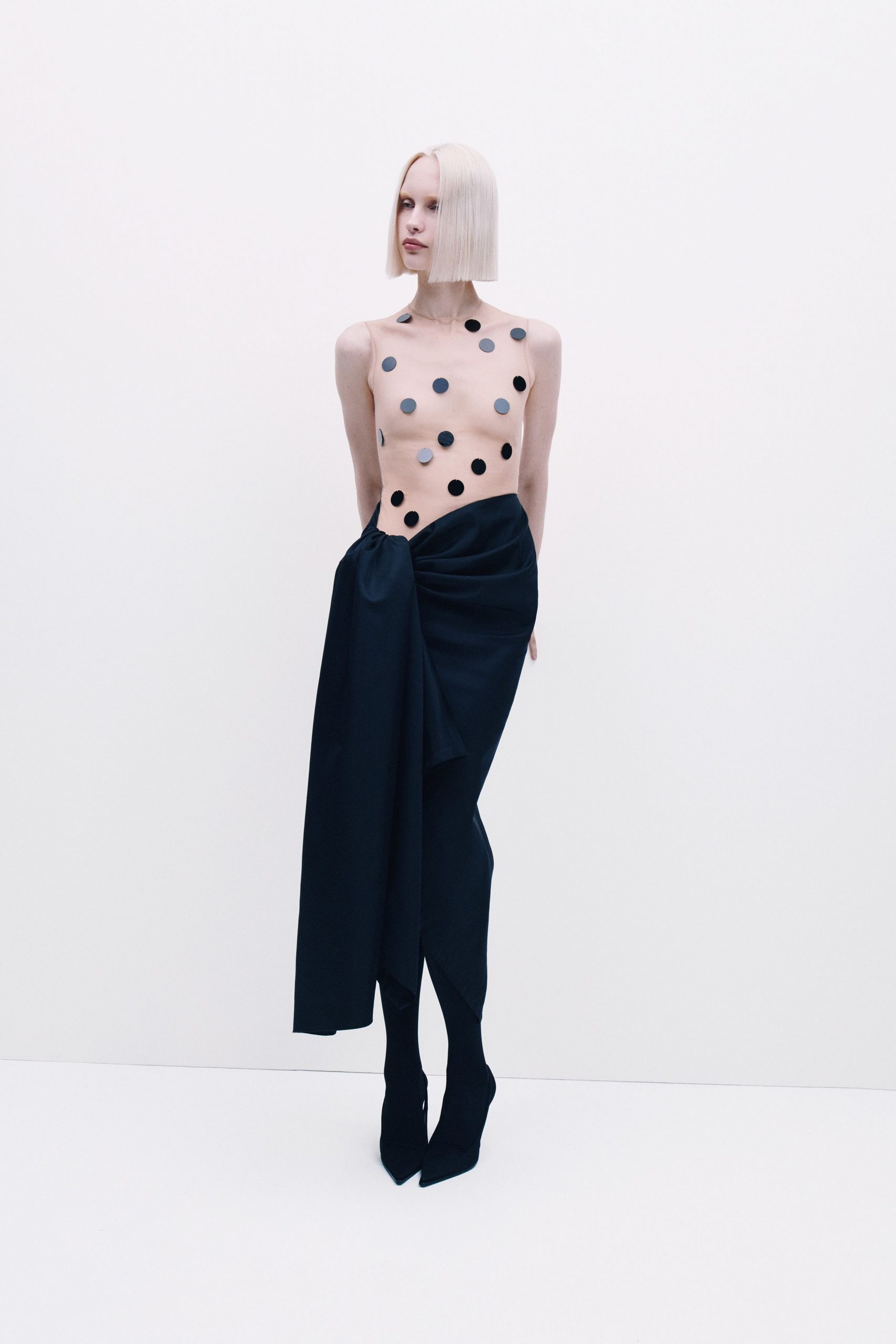 black skirt beige polka-dot top