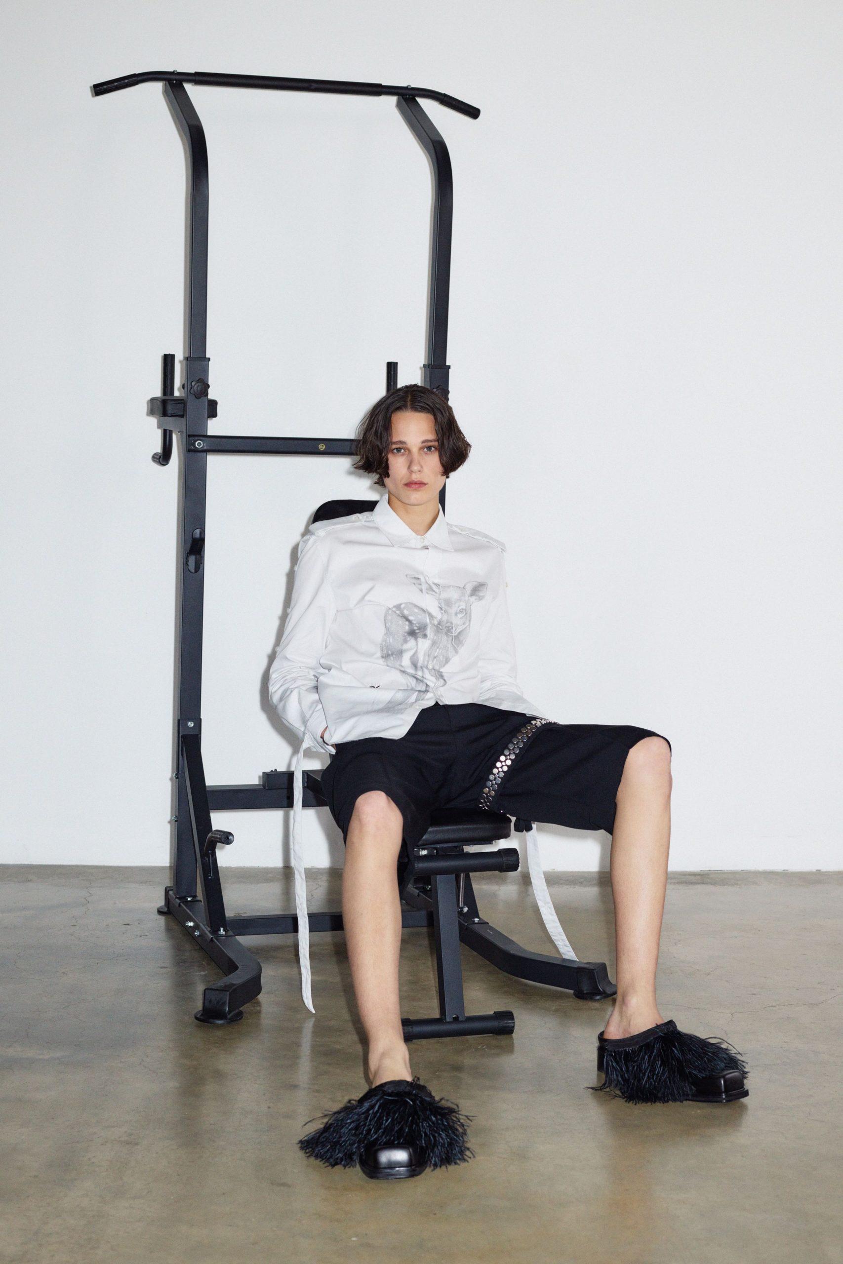 white relaxed shirt with black shorts