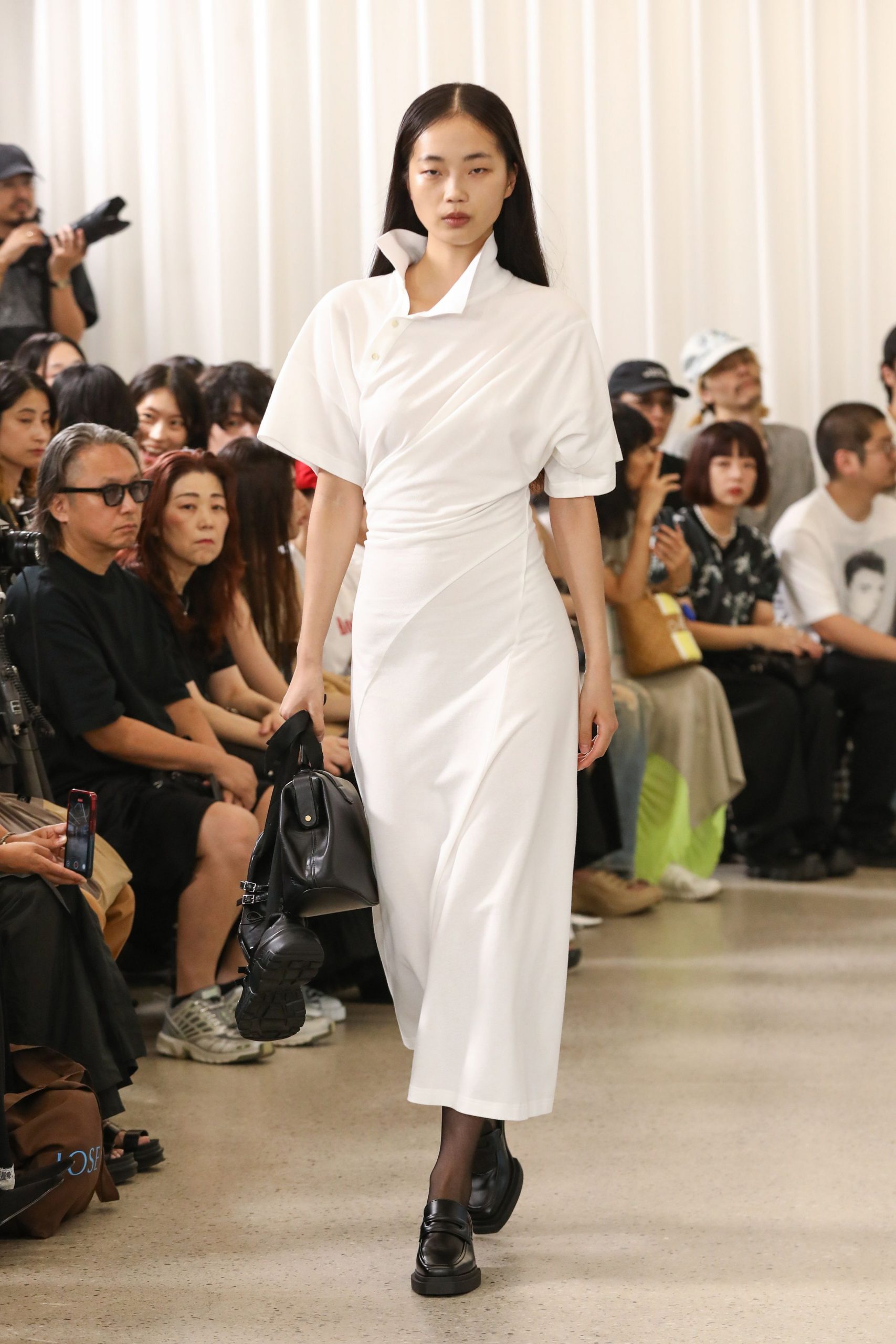 white fitted midi dress with black shoes