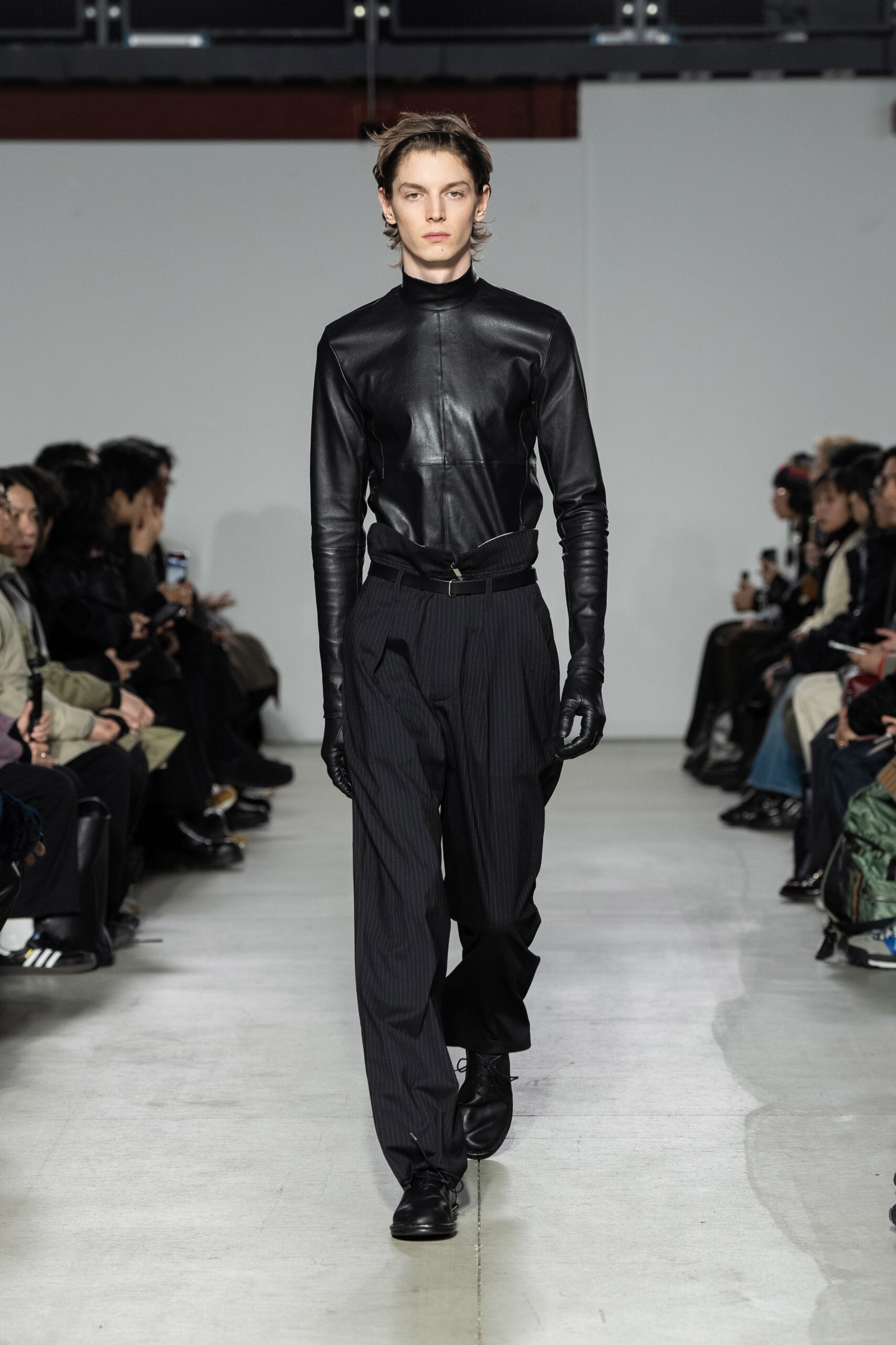 black leather shirt and tailored pants