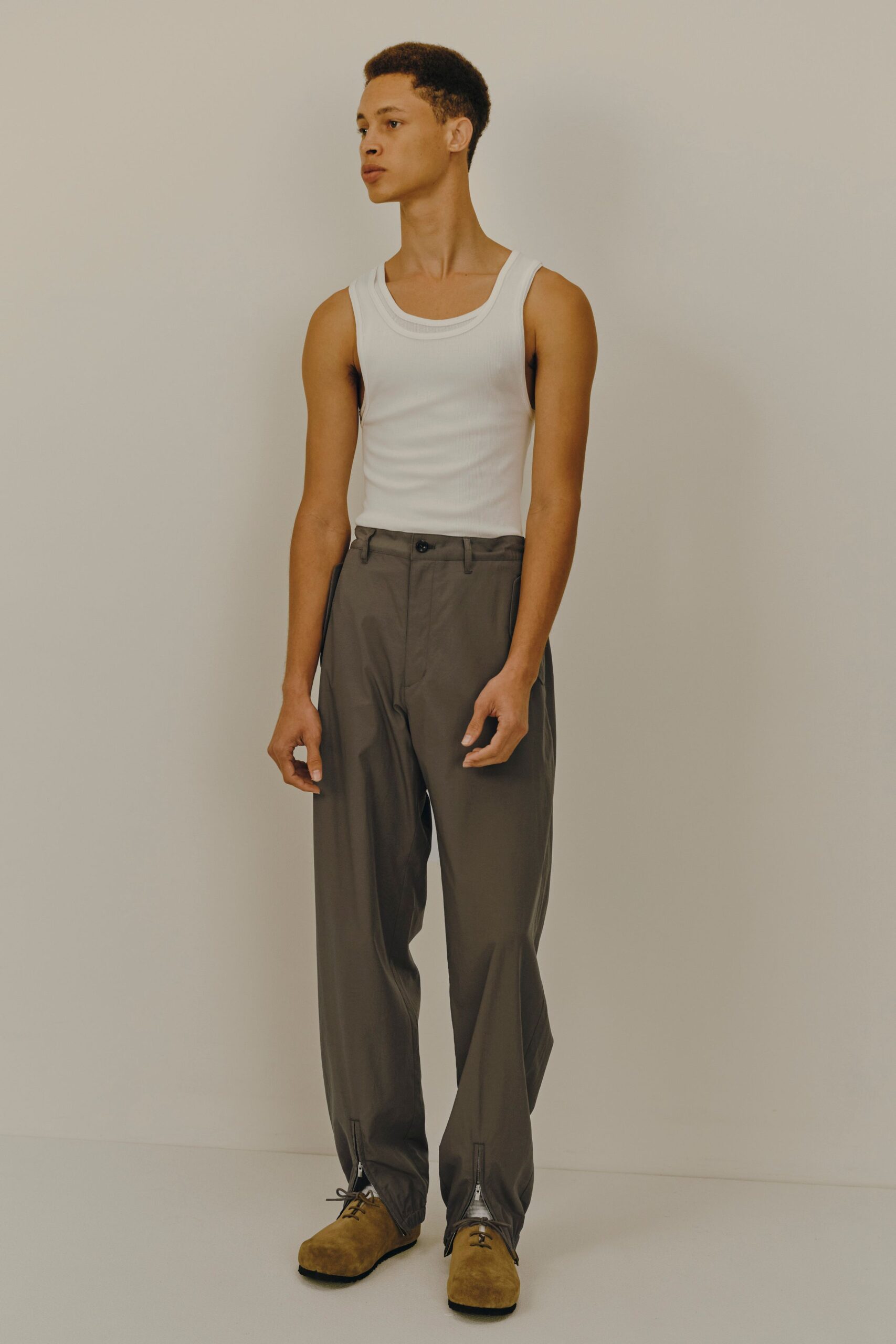 white tank-top gray pants brown shoes