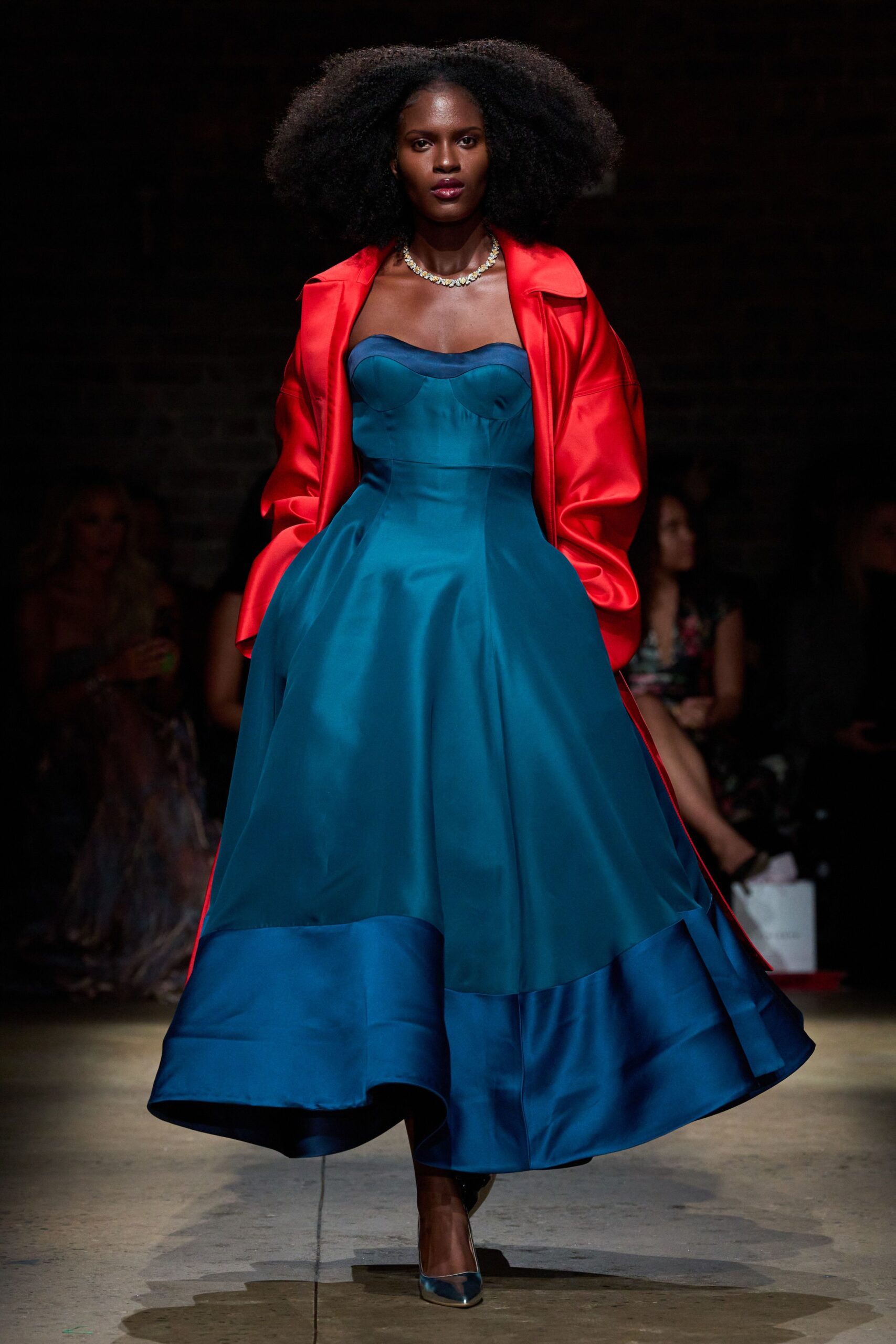 blue silk a-line dress with red coat