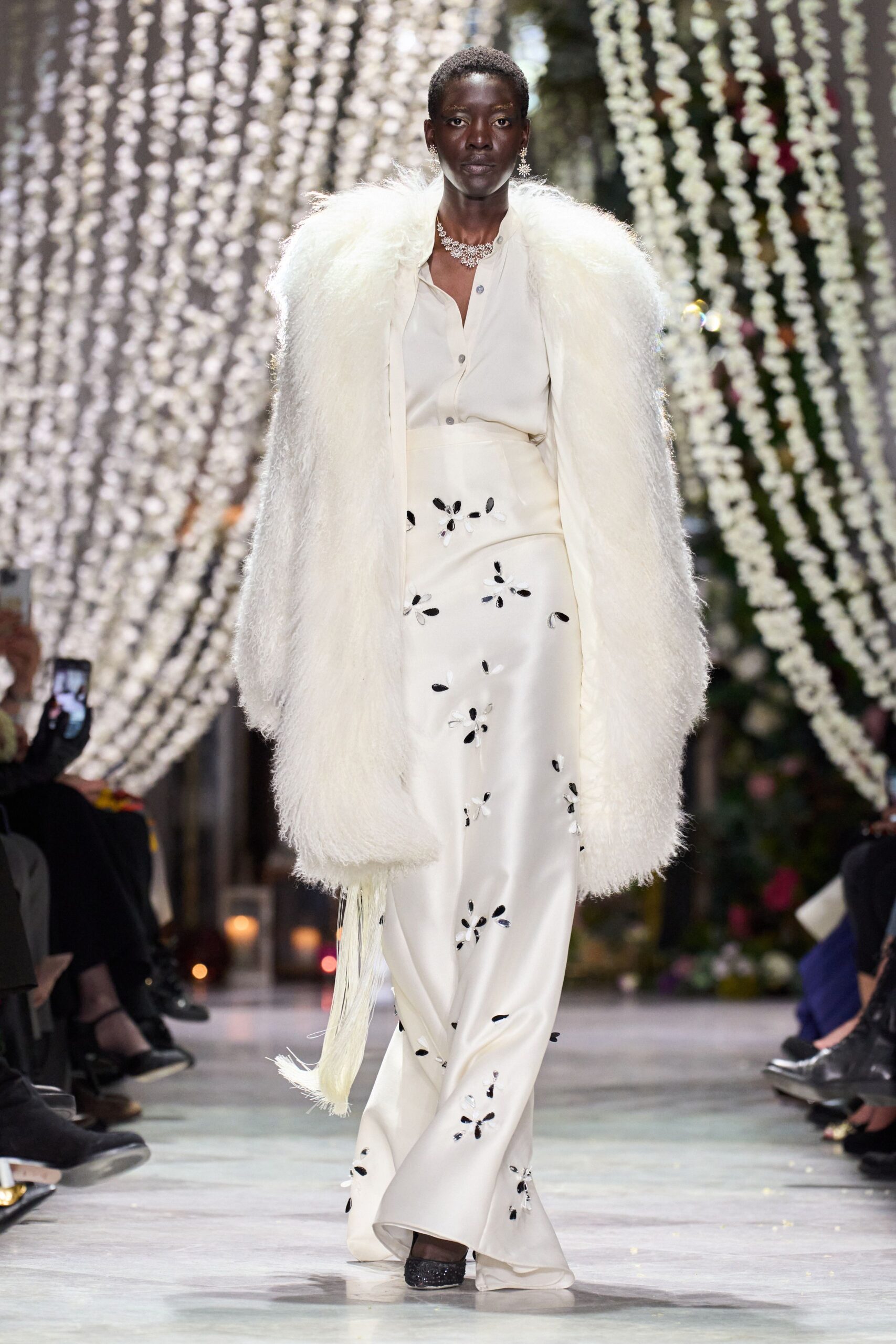 white fur coat with silk outfit